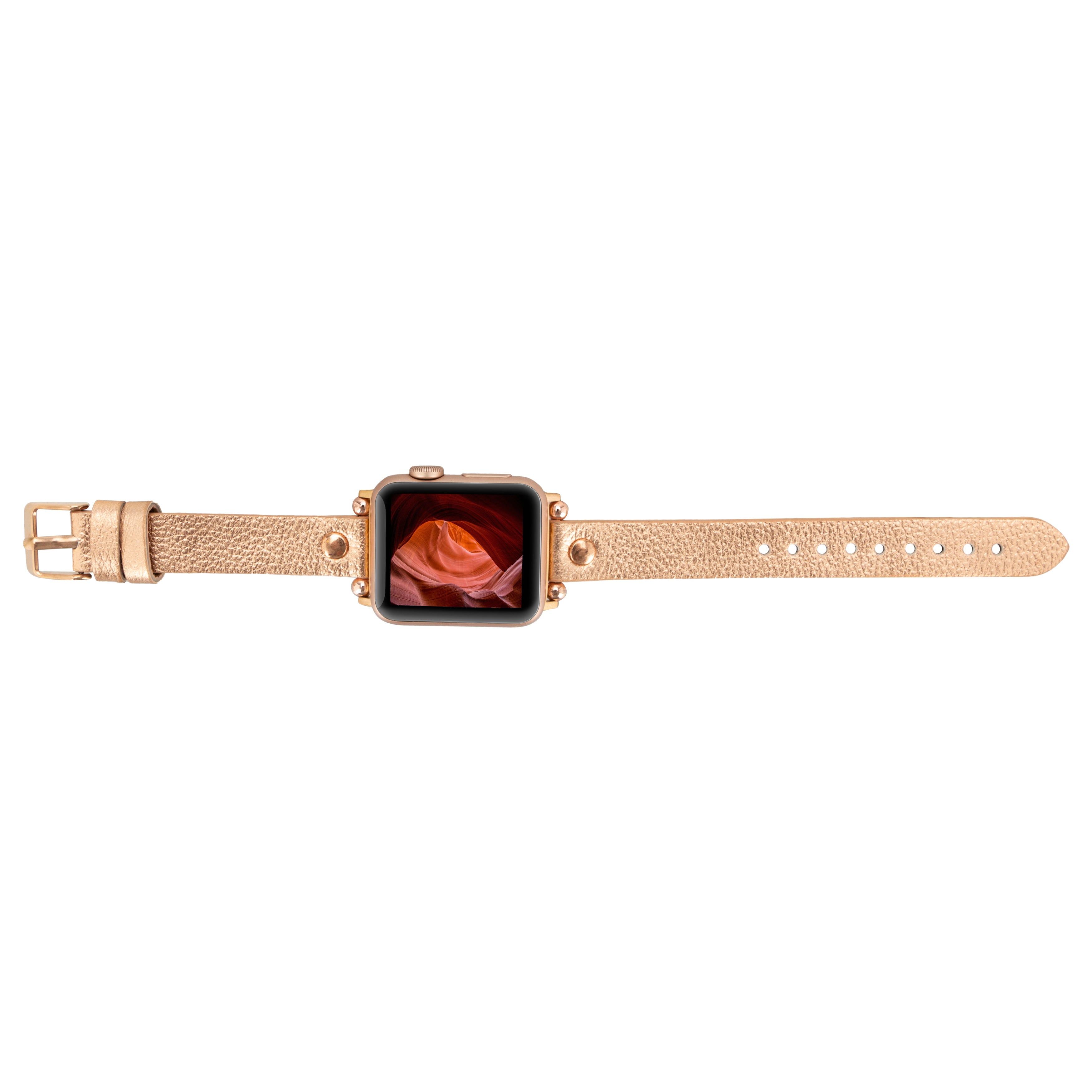 Gül altın rengi Apple Watch, deri kordon ve kanyon duvar kağıdı.