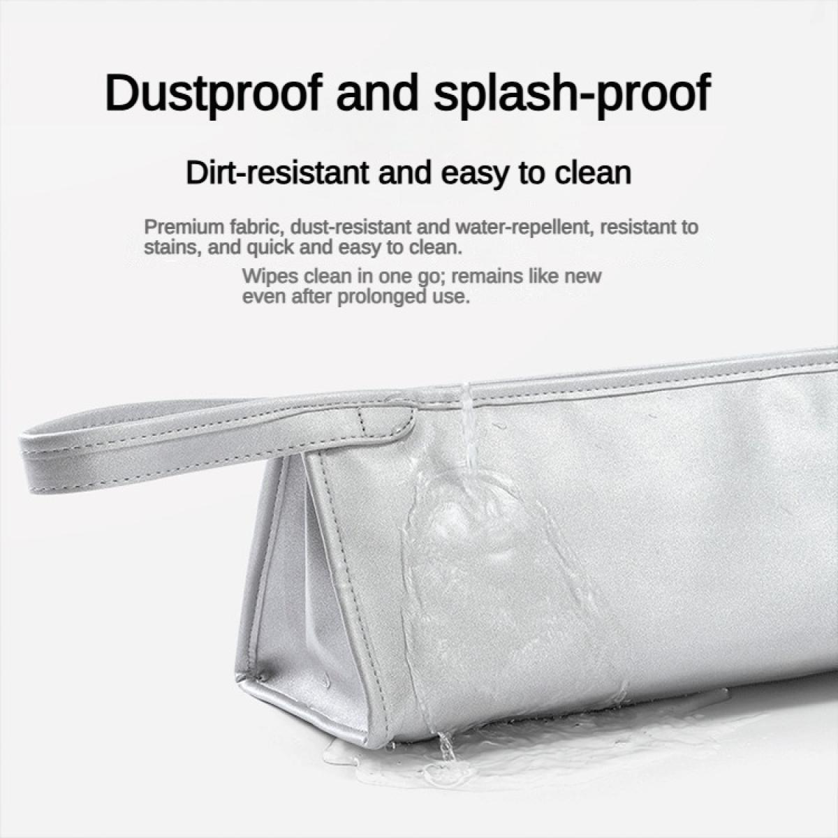 Graue Tasche mit Wasser, die Wasser abweist und schmutzresistent ist.