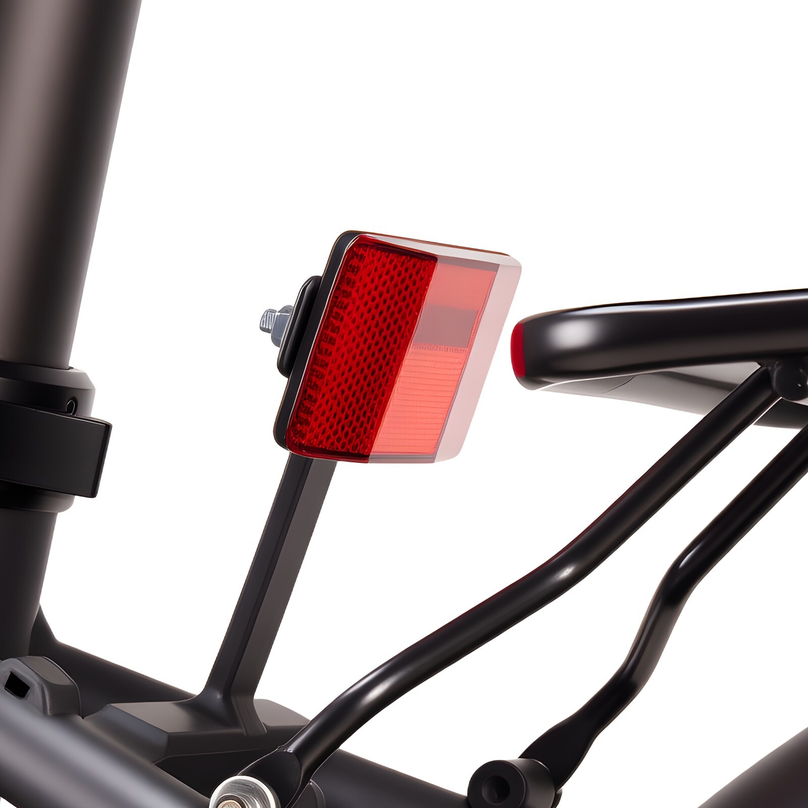 Czerwony odblask rowerowy zamontowany na czarnym bagażniku.