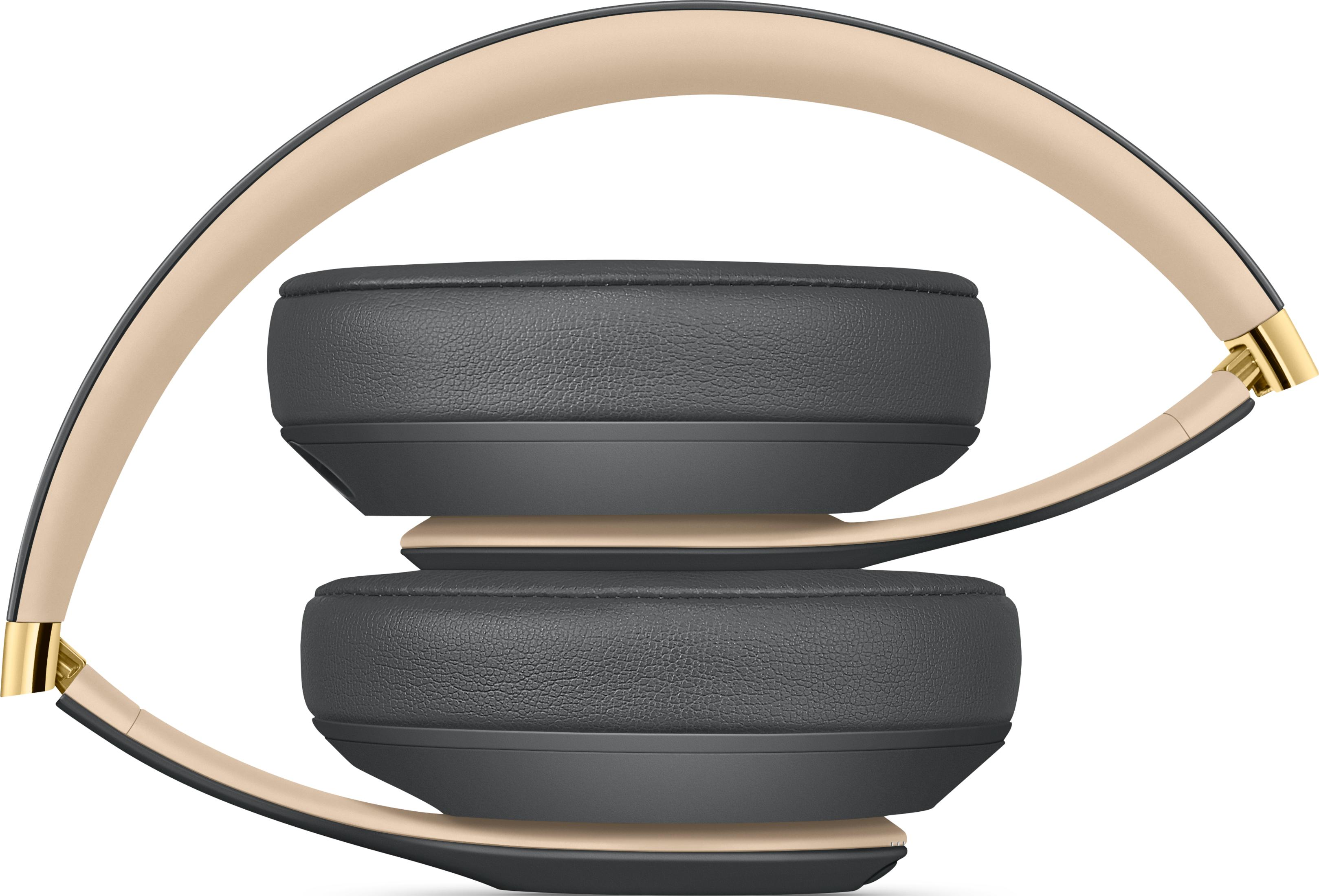 Cuffie grigie con archetto beige e accenti dorati.