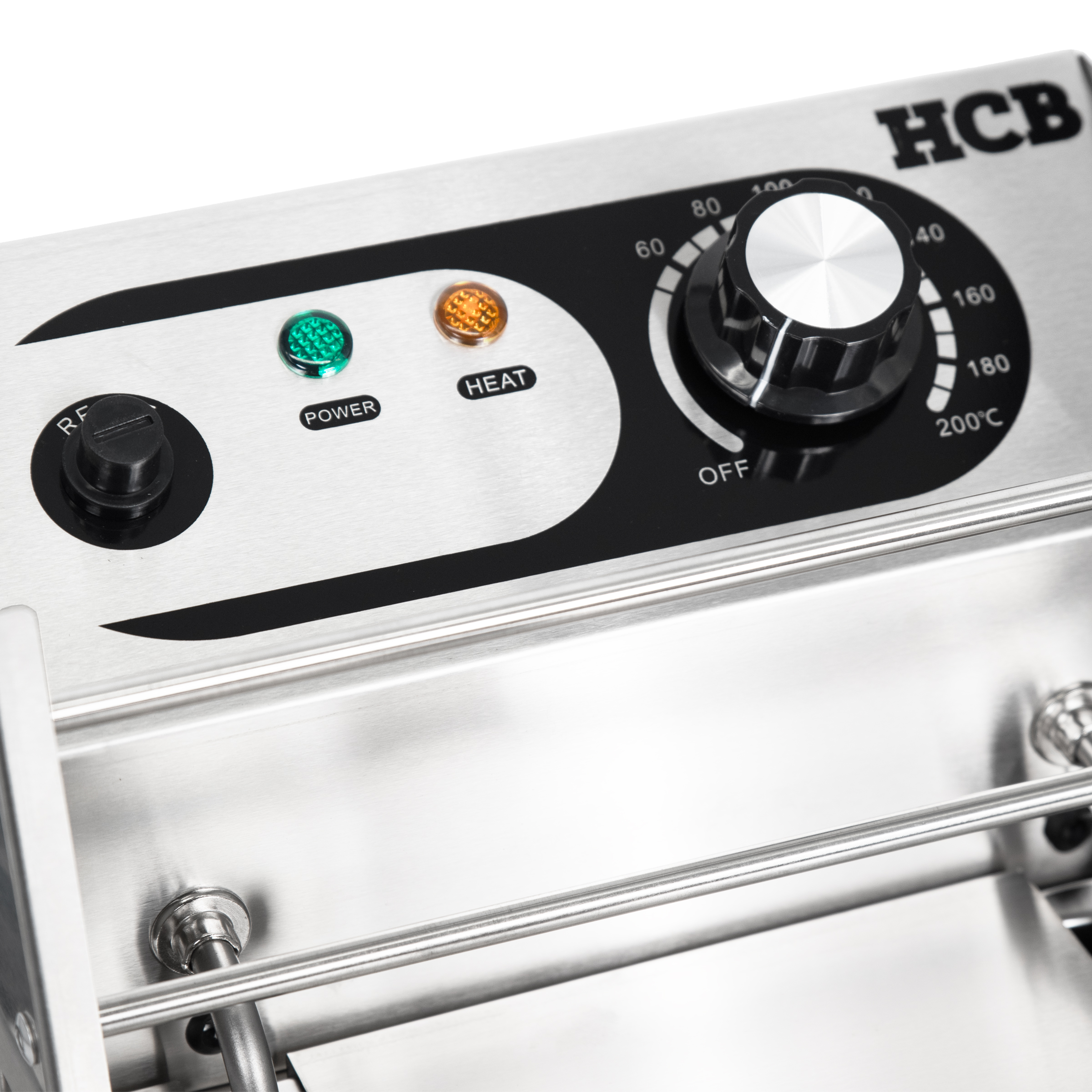 Stainless steel appliance with dial, indicator lights, and HCB logo.