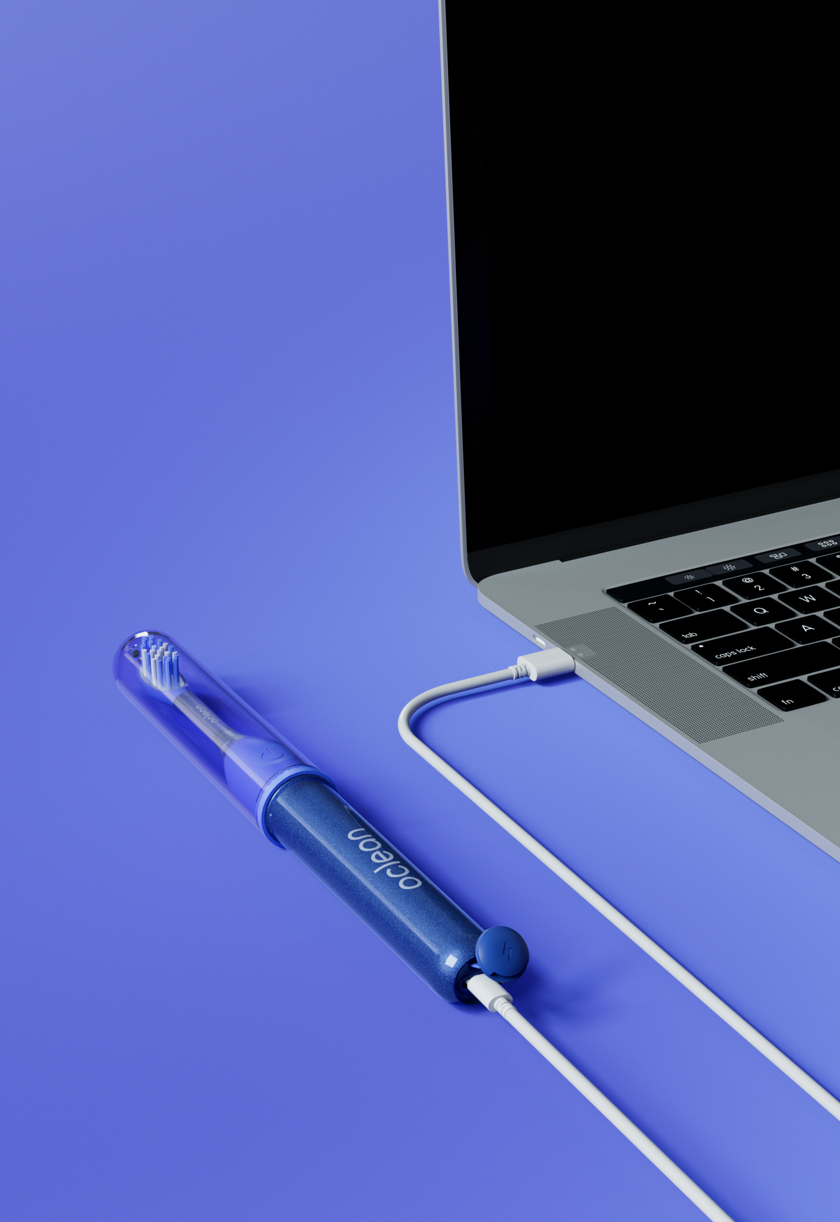 Una custodia blu per spazzolino elettrico con cavo USB collegato a un laptop.