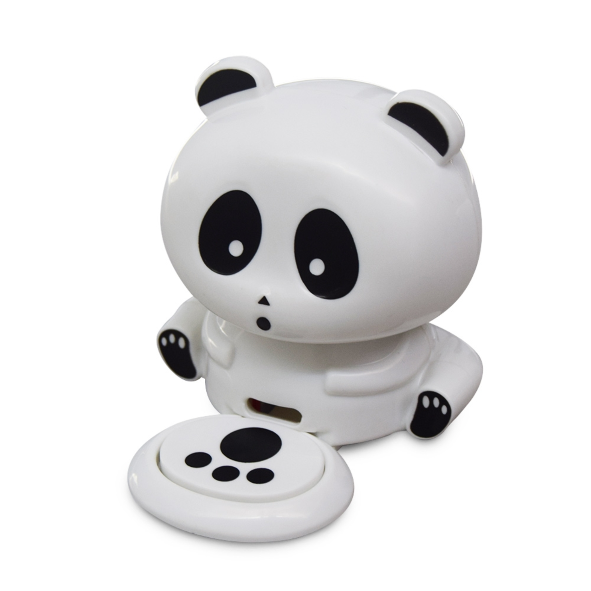 A white panda speaker with black eyes and ears sits next to a round base.