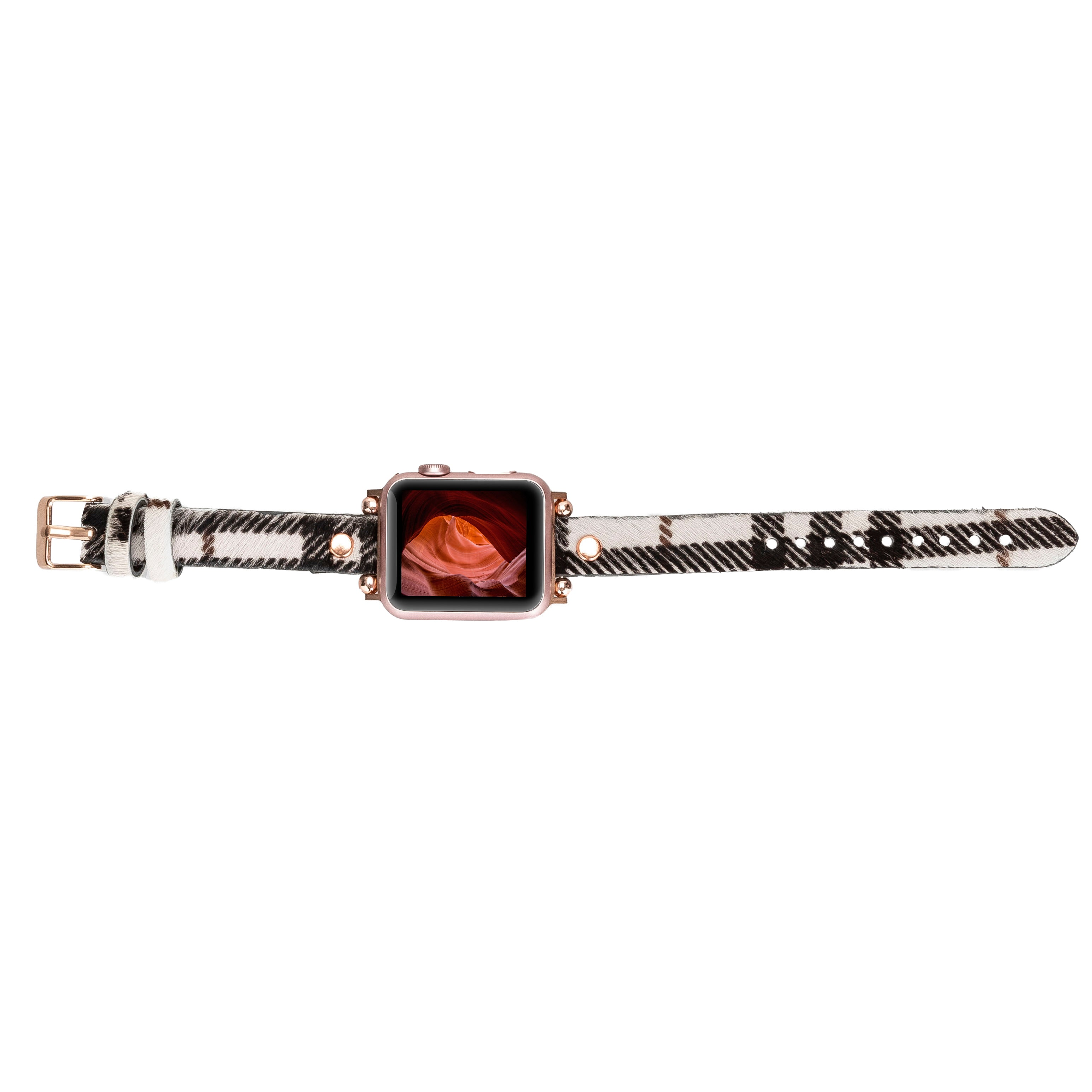 Ekranında kanyon gösteren, ekoseli kordonlu rose gold akıllı saat.