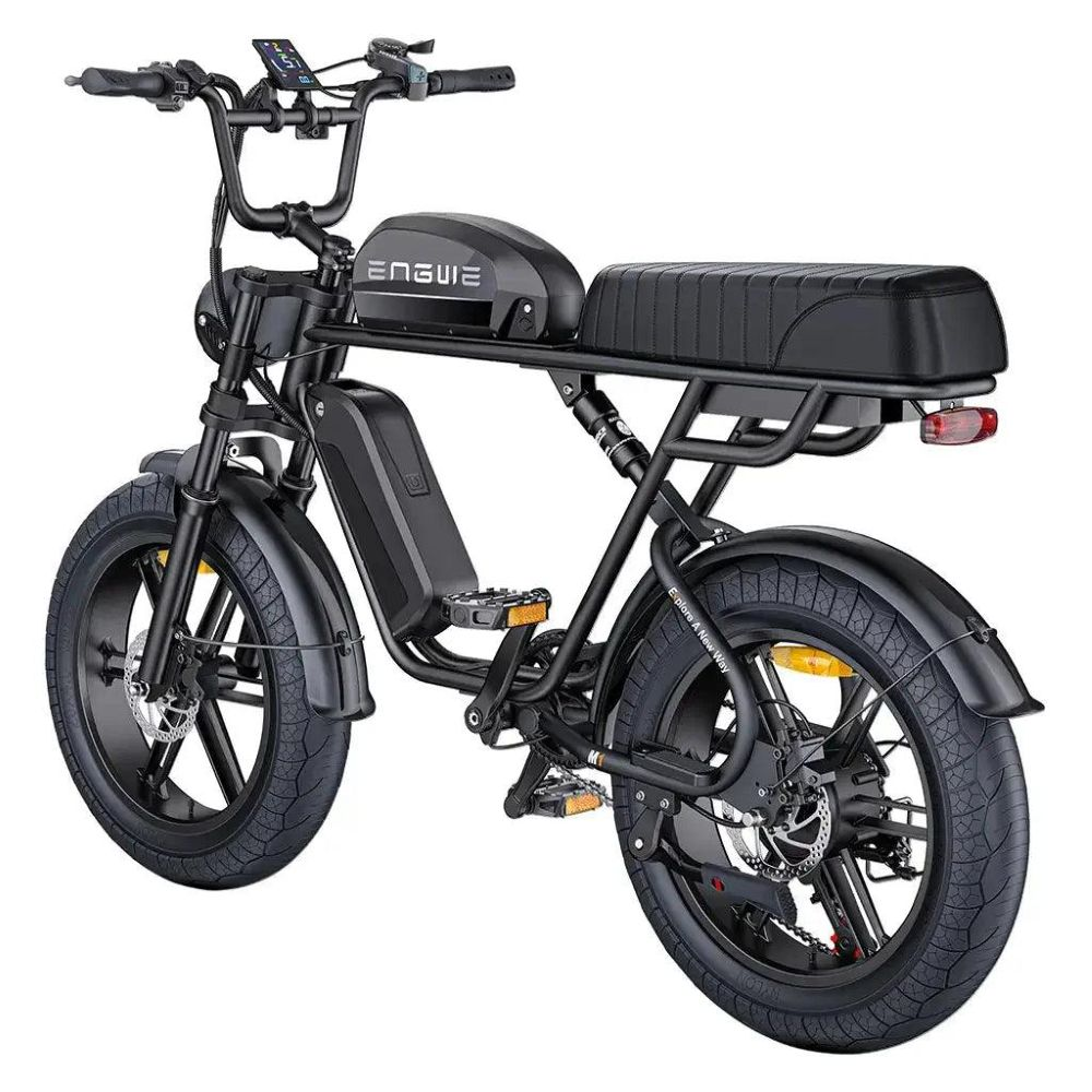 Una bicicleta eléctrica negra de diseño retro, con neumáticos gruesos, pantalla digital y asiento acolchado.