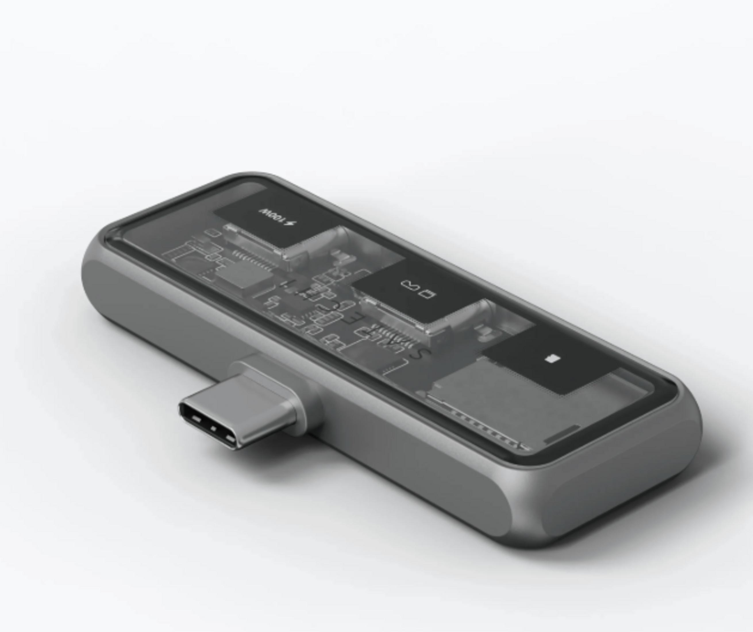 Ein grauer USB-C-Adapter mit transparentem Gehäuse, der interne Komponenten zeigt.