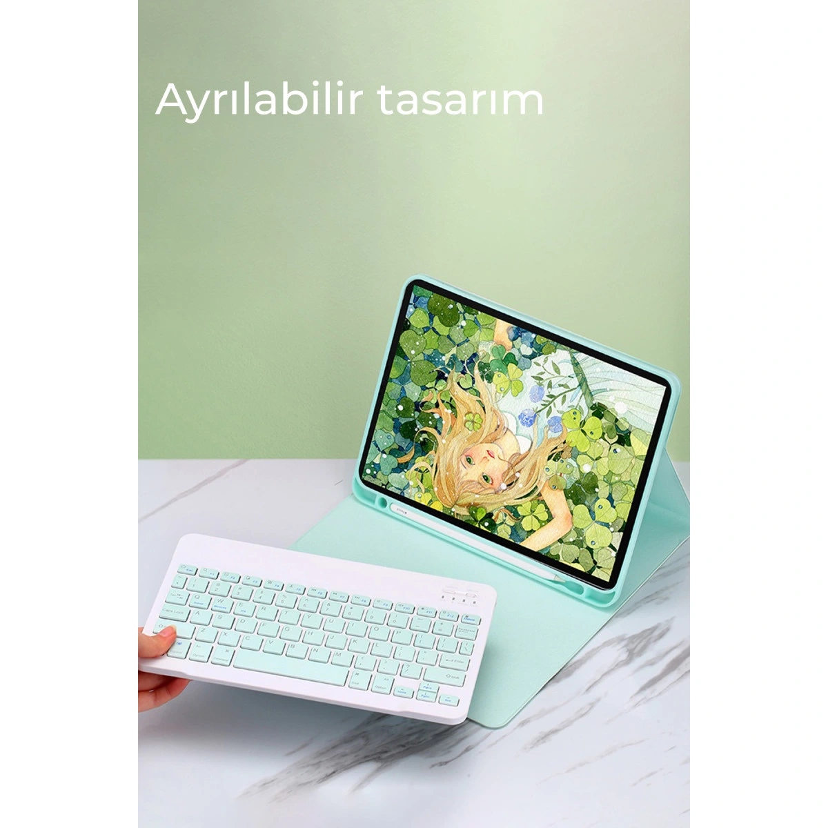 Masa üzerinde peri illüstrasyonlu tablet ve beyaz klavye.