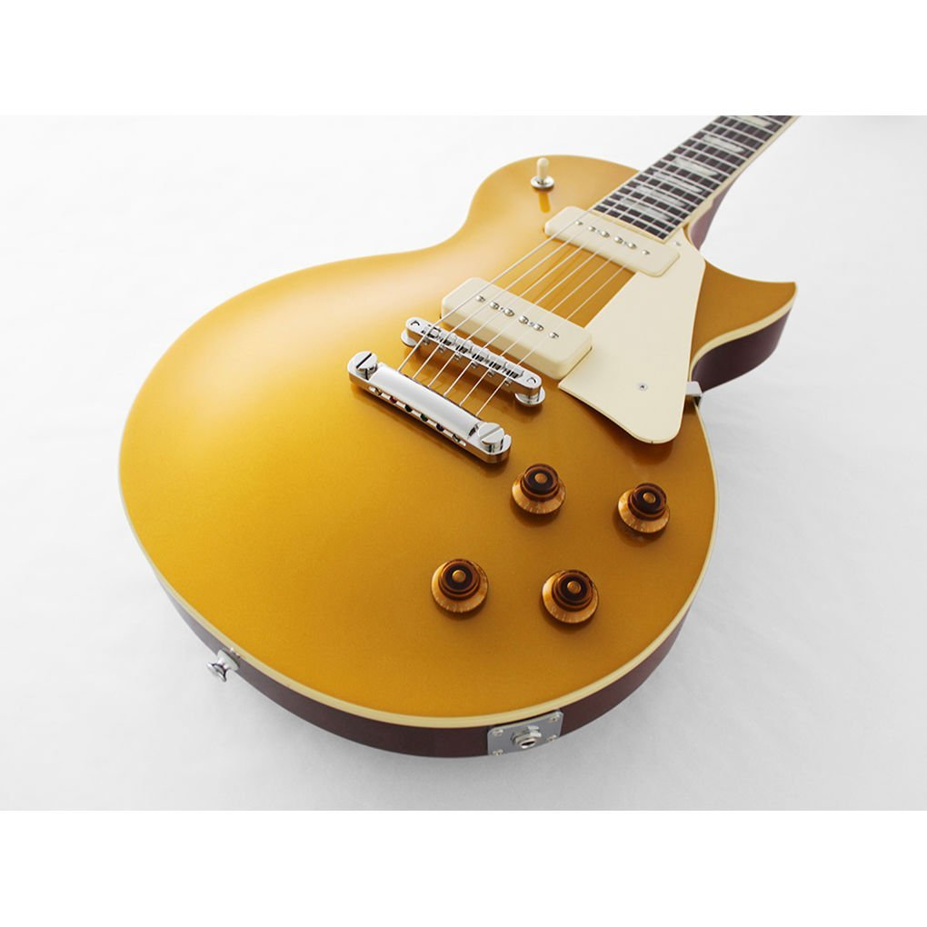 Altı telli altın rengi elektro gitar, krem rengi manyetik kapak ve kahverengi gövde.