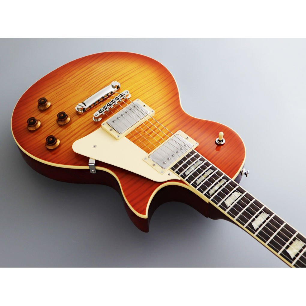Güneş patlaması bitişli elektro gitar gövdesi, krom donanım ve krem rengi pena koruyucusu.