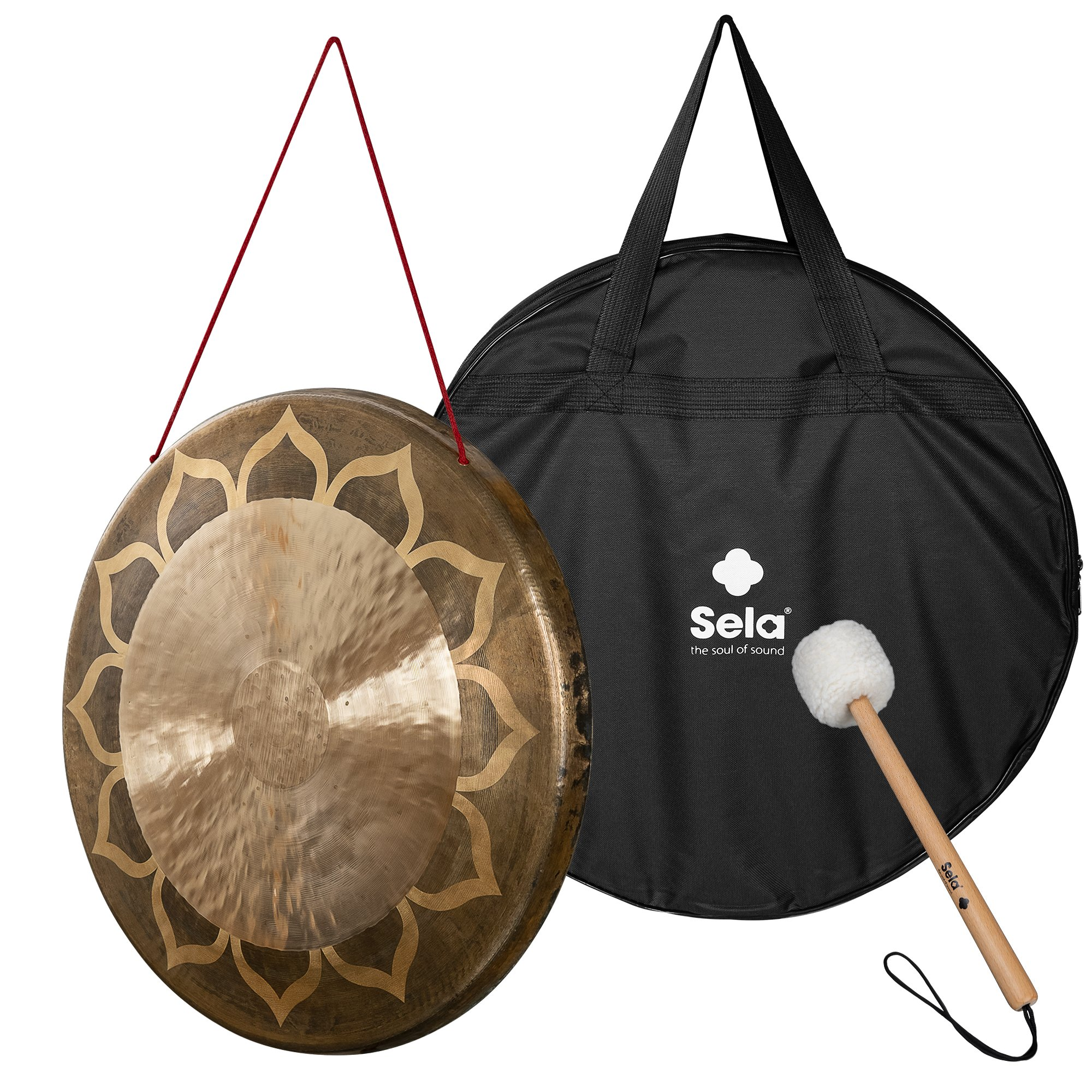 Lotus desenli bronz gong, kırmızı iple asılı, tokmaklı siyah çantanın yanında.