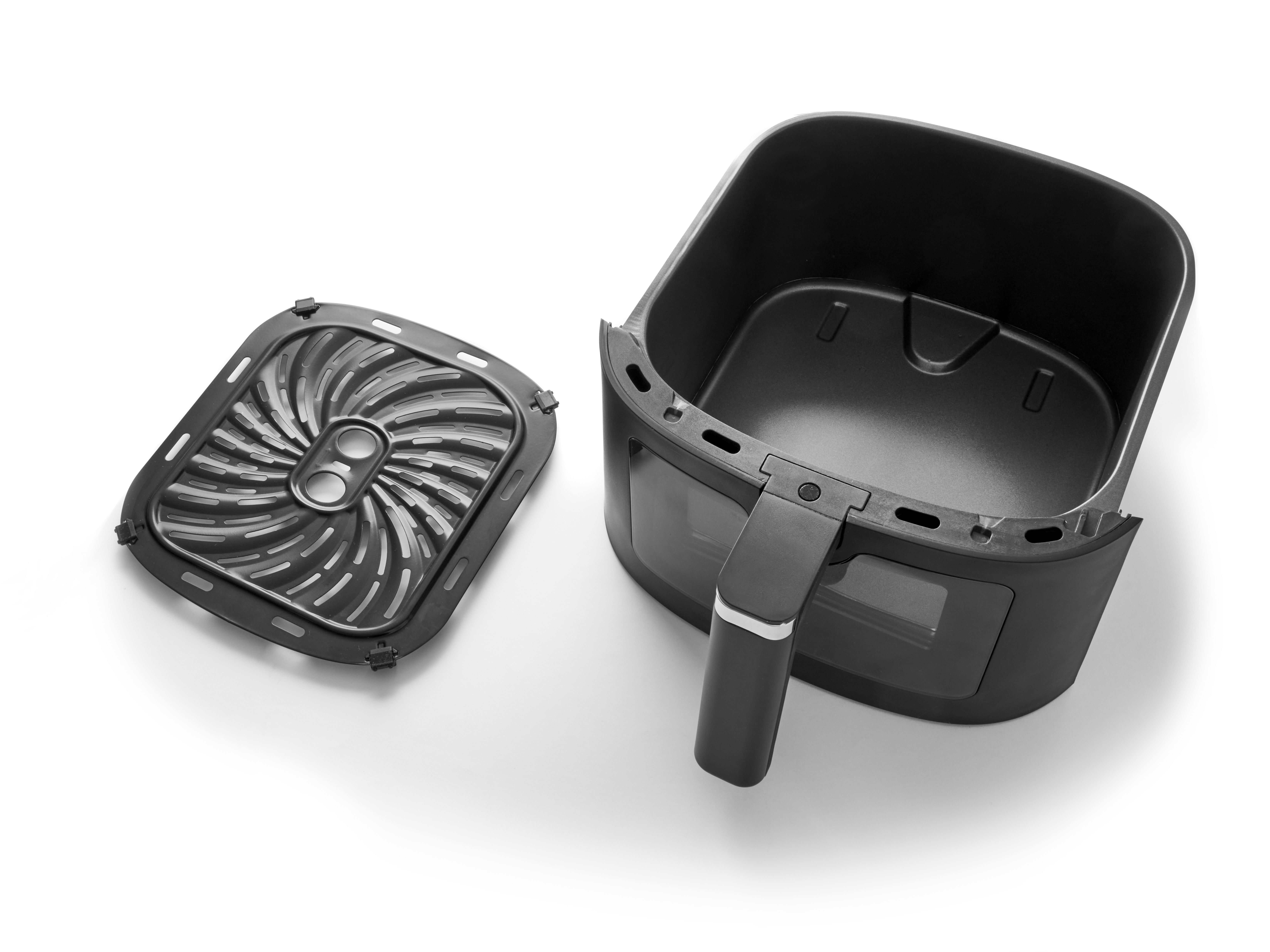 A black air fryer basket and a grate lie side-by-side on a white background.