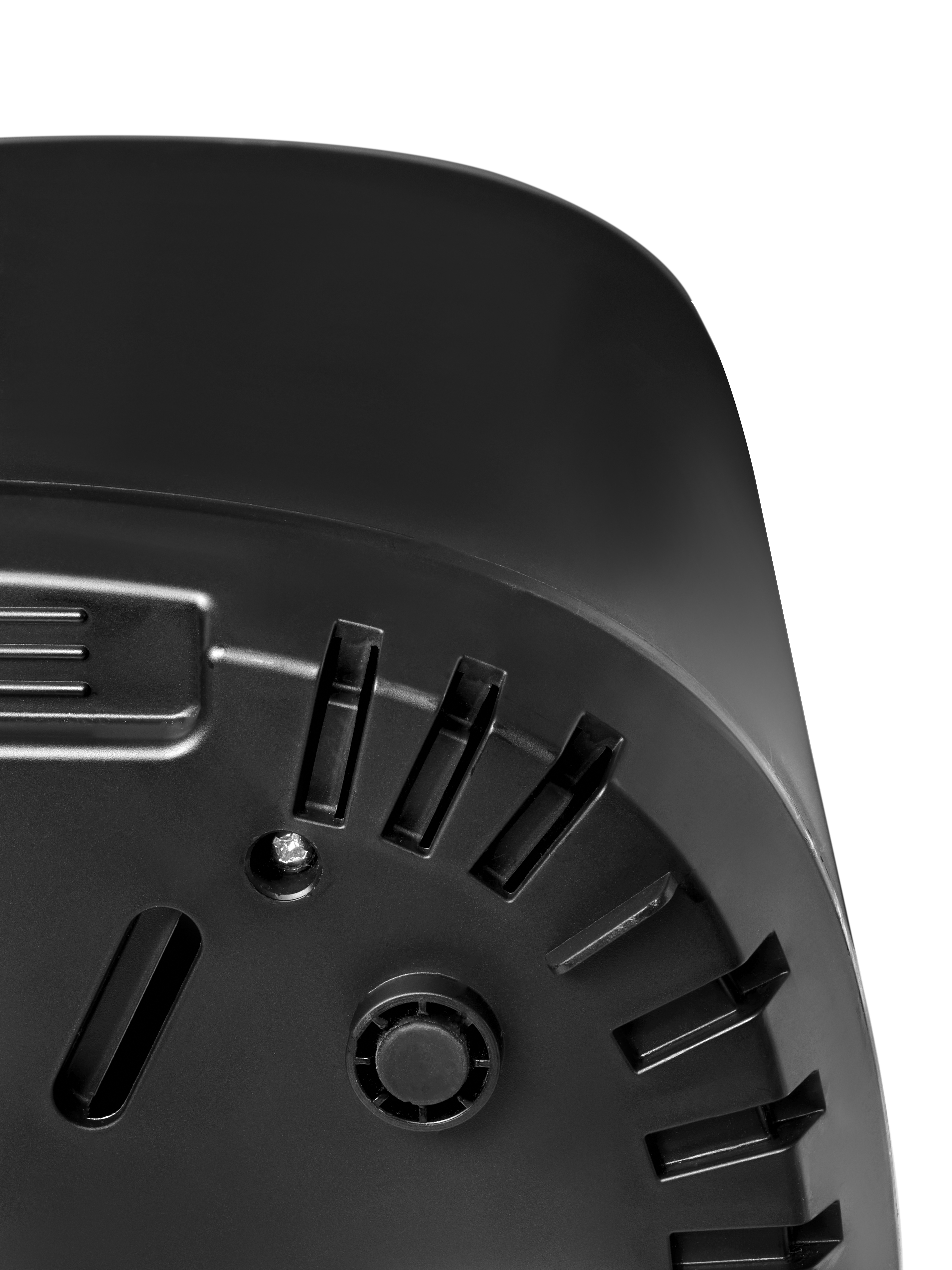 Close-up of the black bottom of a device with vents and a foot.