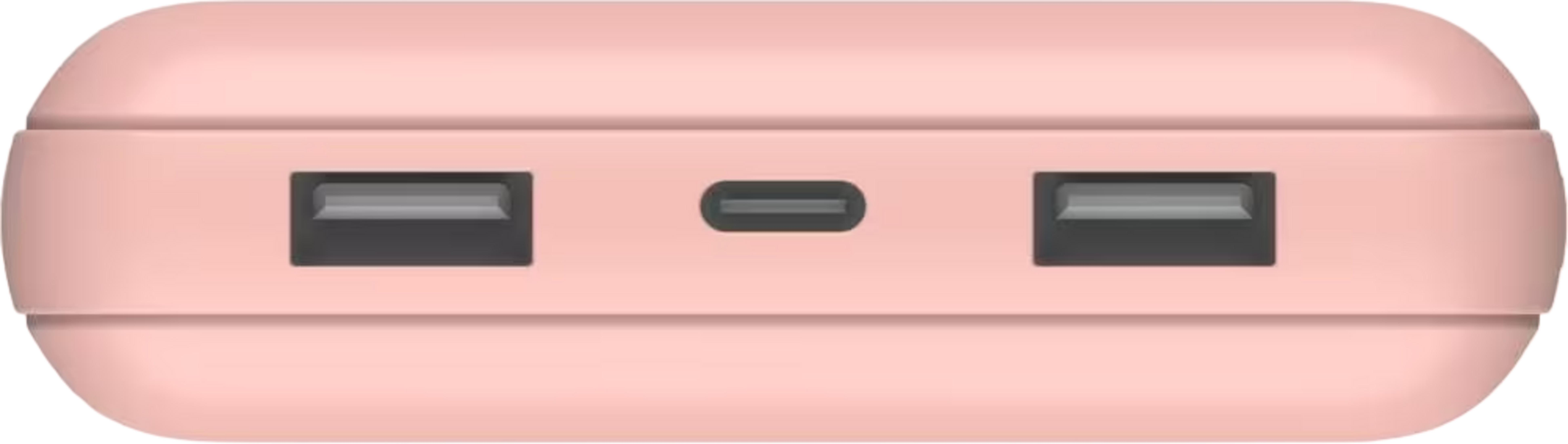 Une batterie externe rose avec deux ports USB-A et un port USB-C.