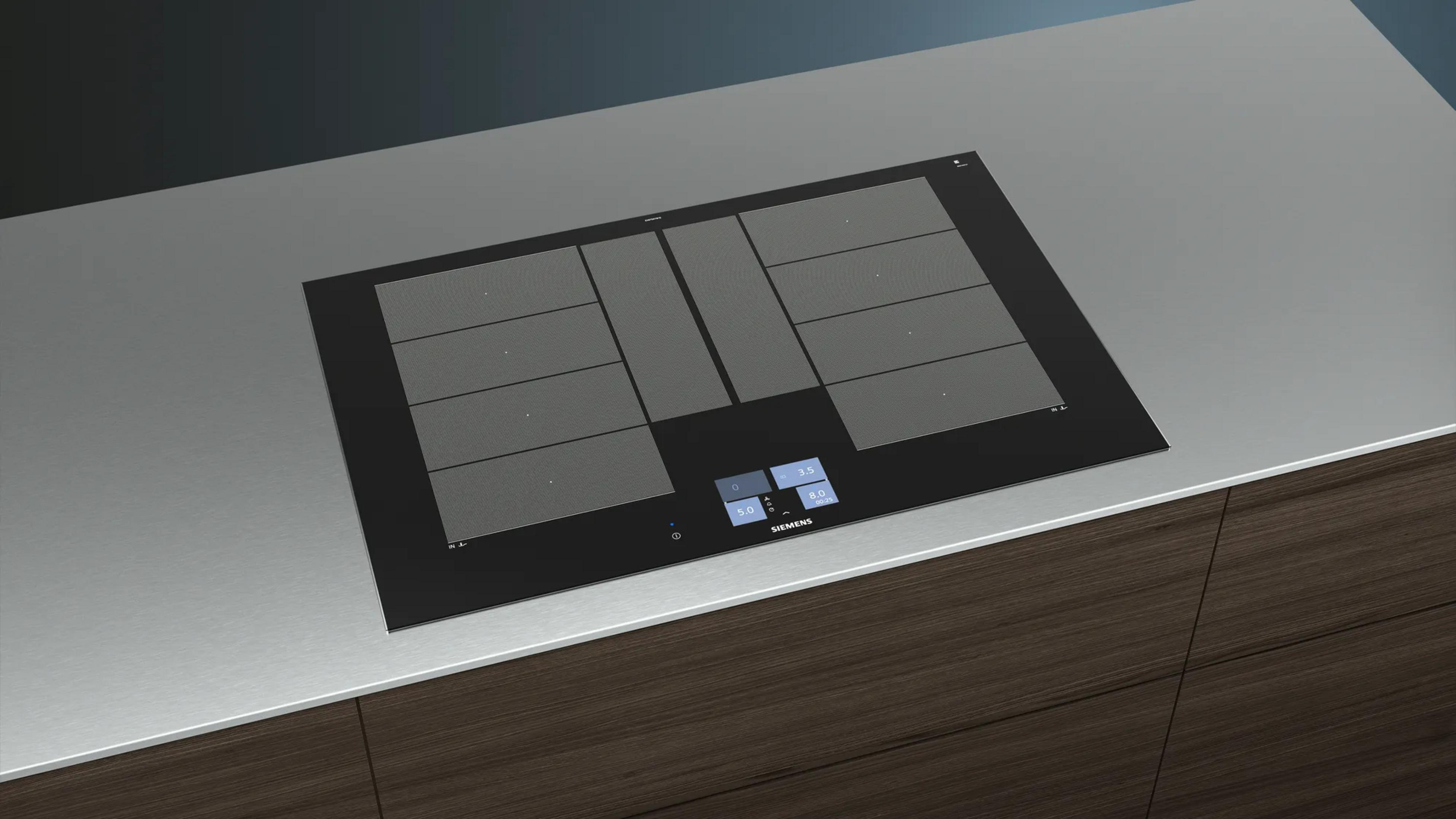 Placa de inducción con controles táctiles y zonas de cocción en superficie de cristal negro.