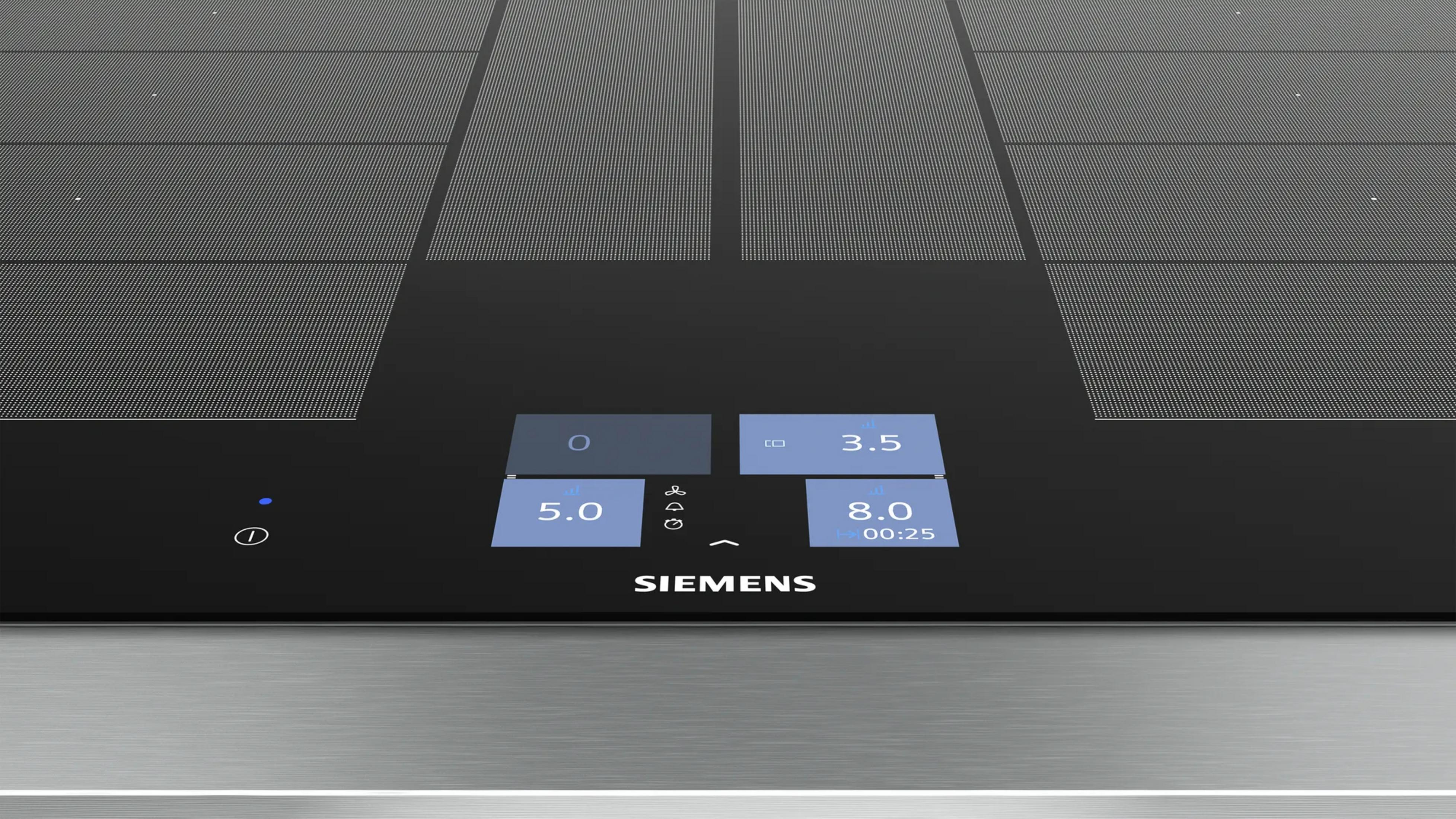 Una placa de inducción Siemens con panel de control táctil que muestra temperaturas.