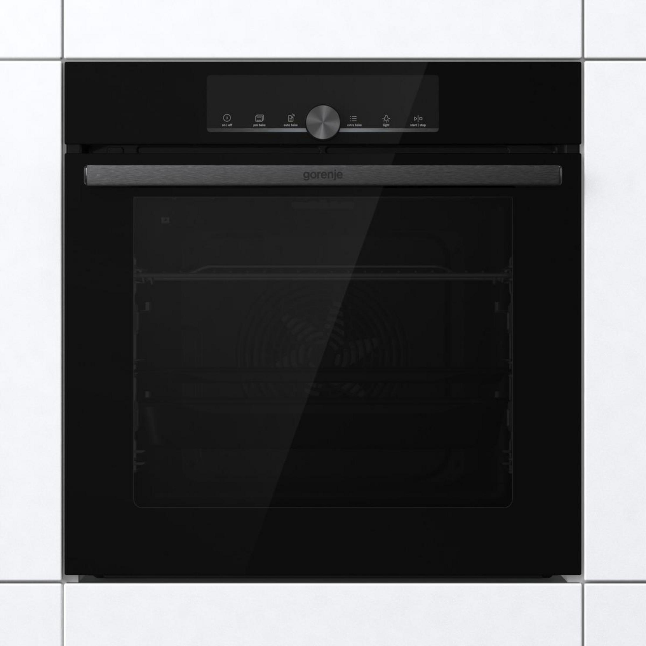 Nowoczesny czarny piekarnik Gorenje z panelem dotykowym i szklanymi drzwiami.