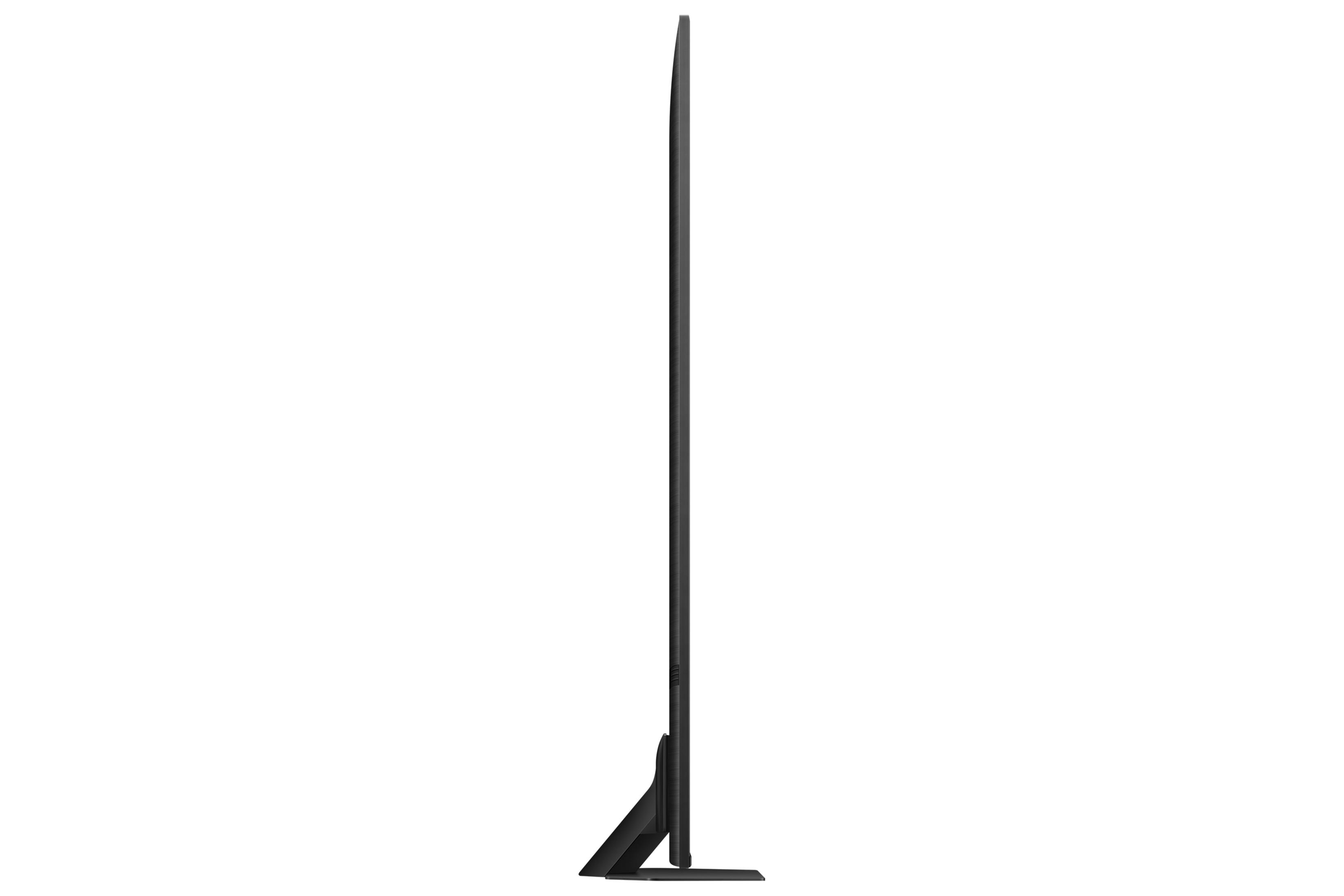 Un téléviseur noir et fin avec un pied étroit, vu de côté.