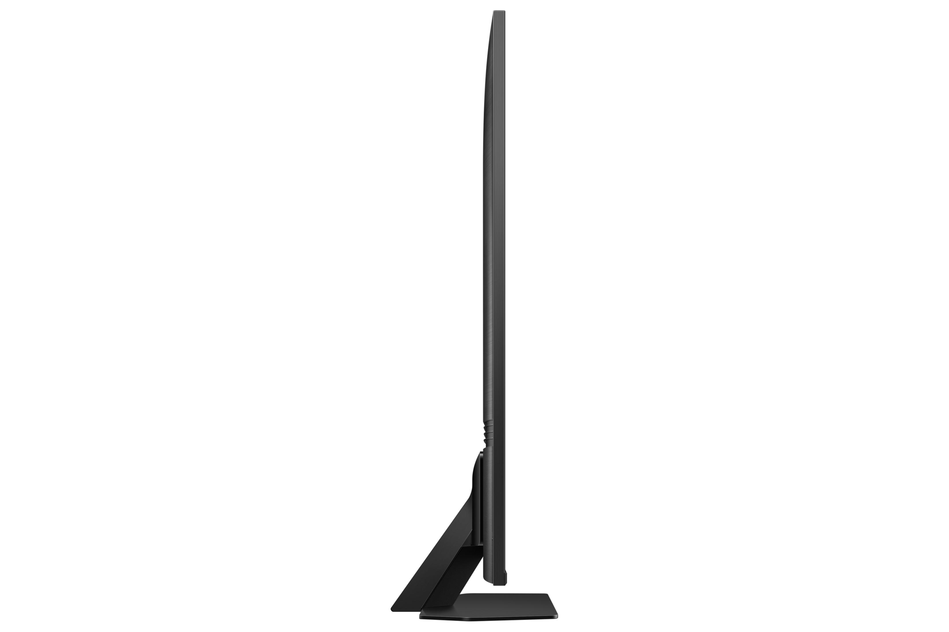 Side view of a slim black television with a black stand.