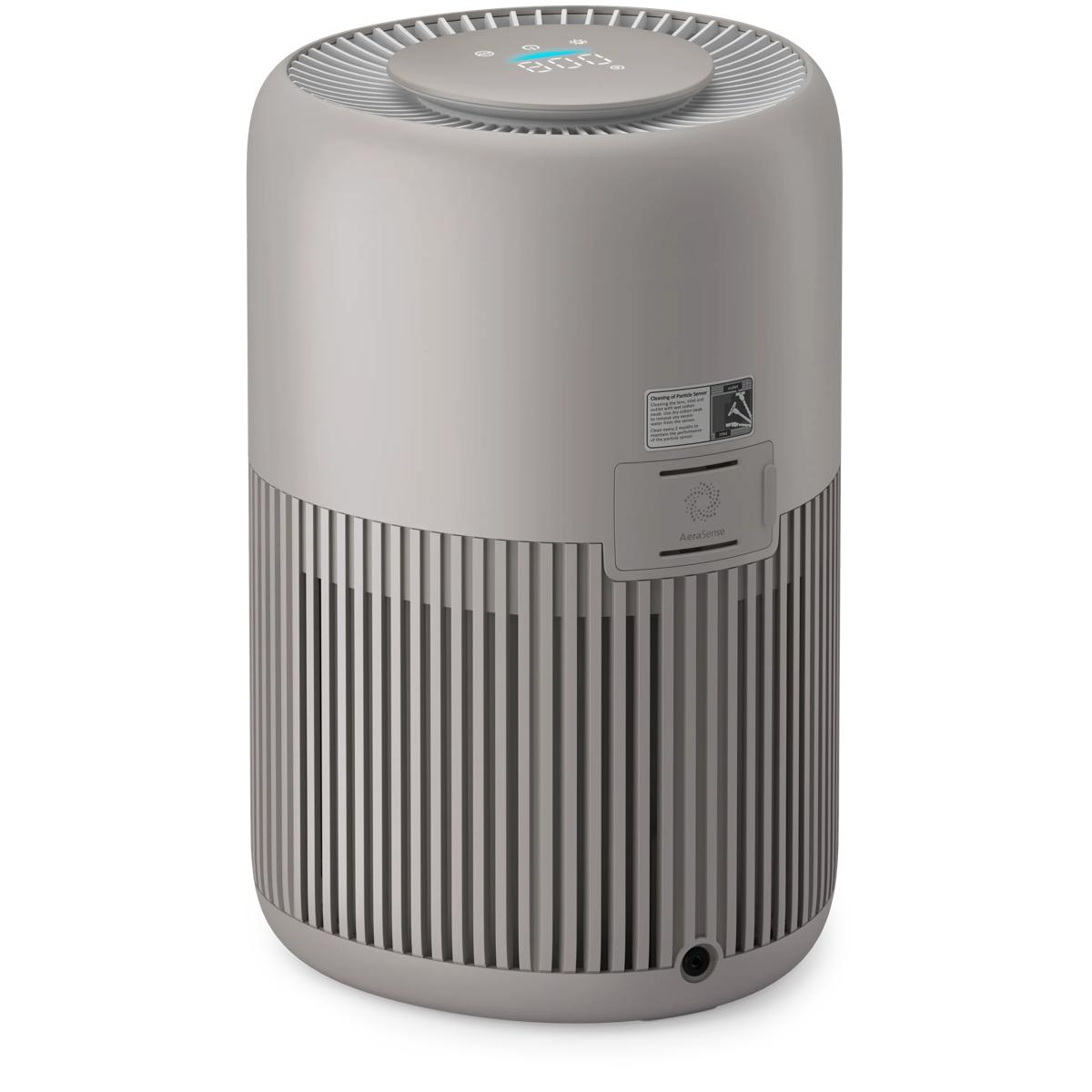 A gray cylindrical air purifier with a digital display on top sits on a white background.