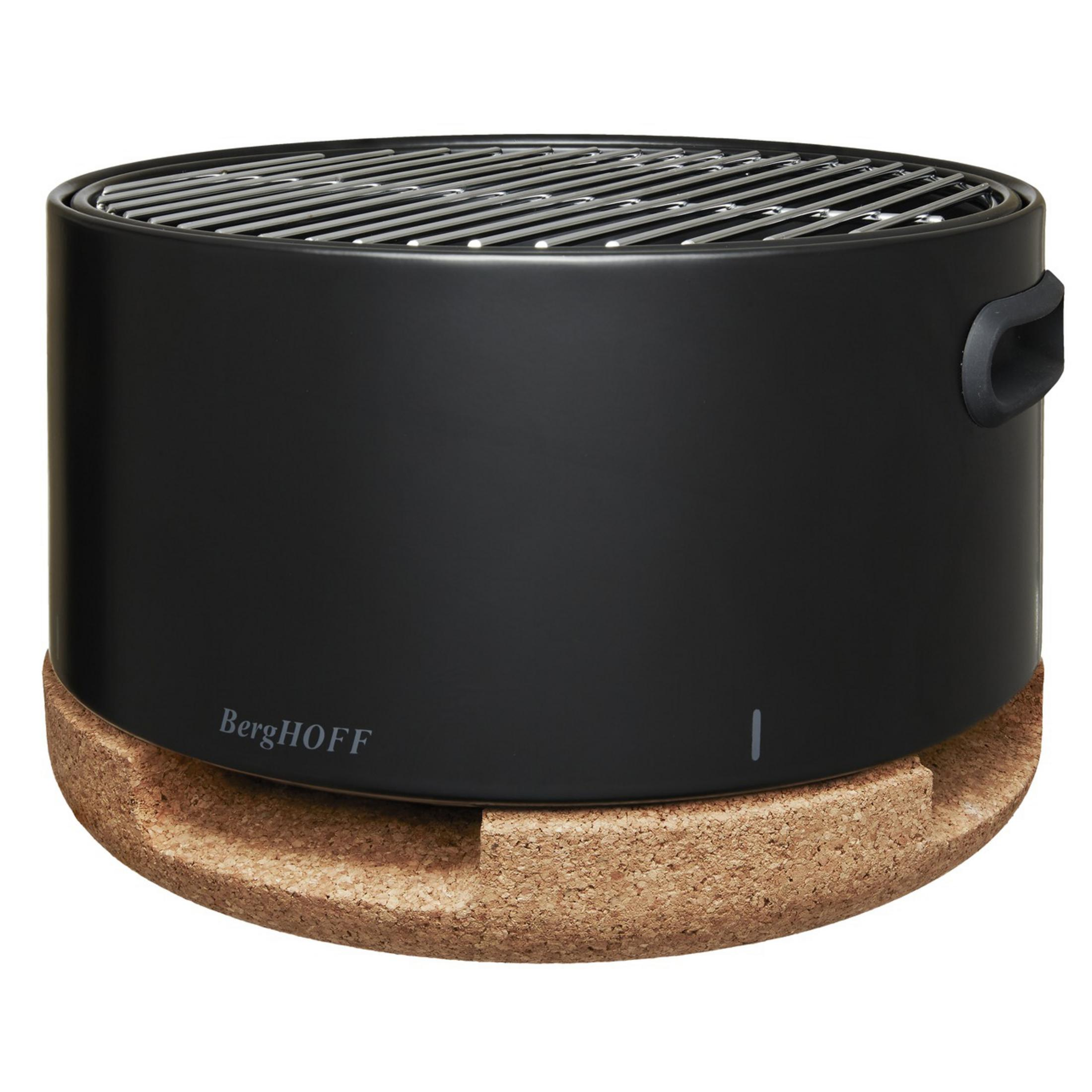 Black grill with silver grate on a round cork base.