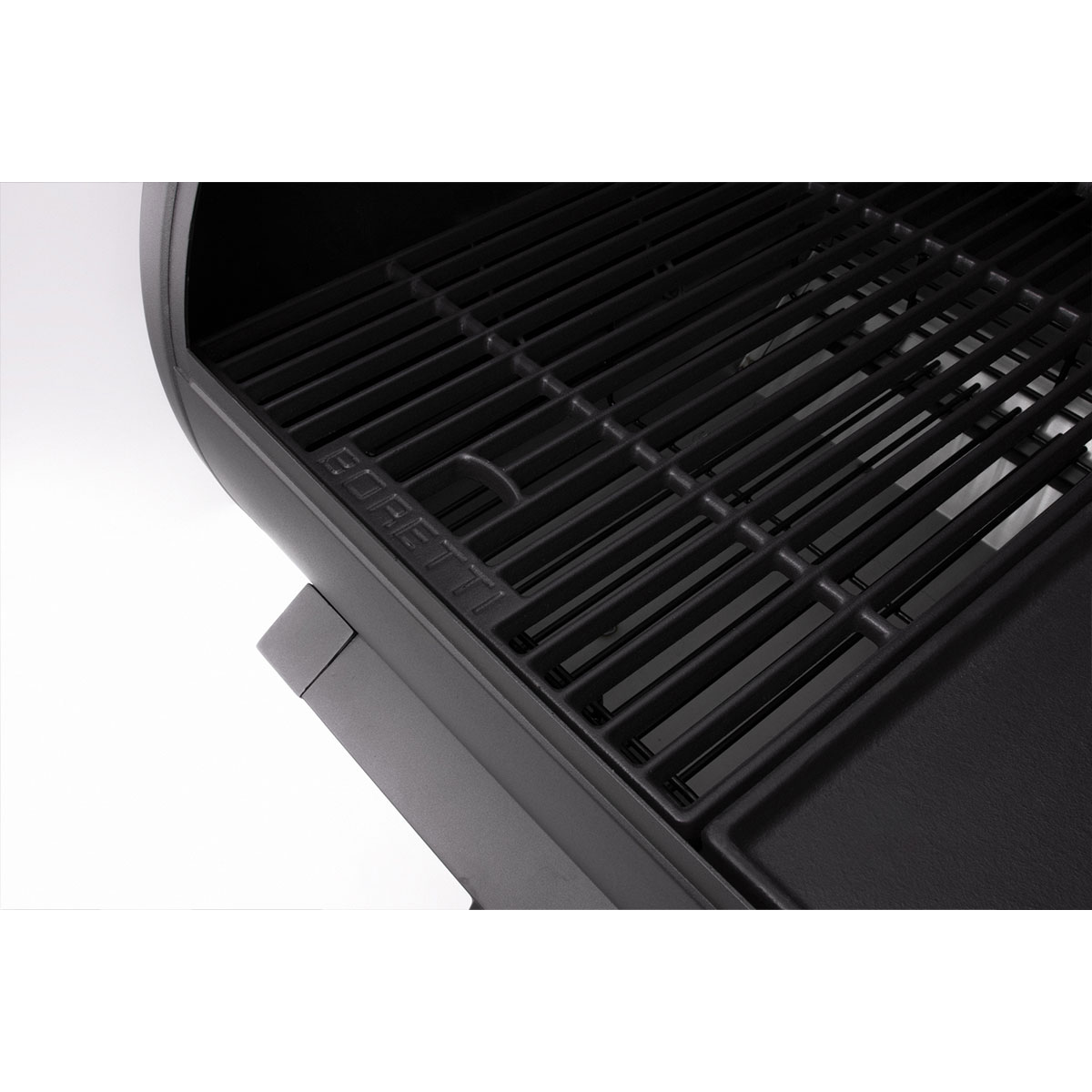Close-up of a black grill grate with the BORETTI logo.