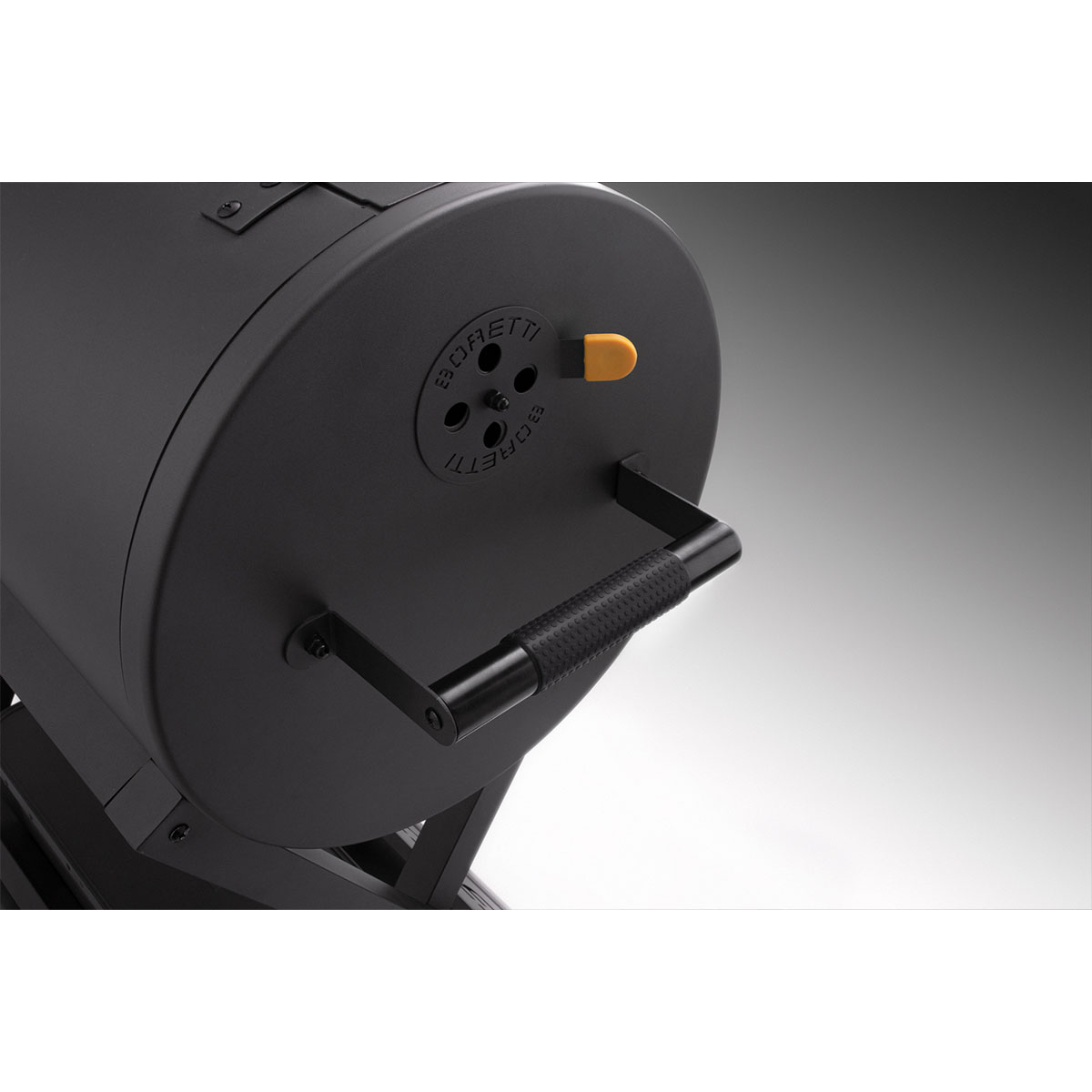 Black grill with handle and yellow knob. BORETTI brand.
