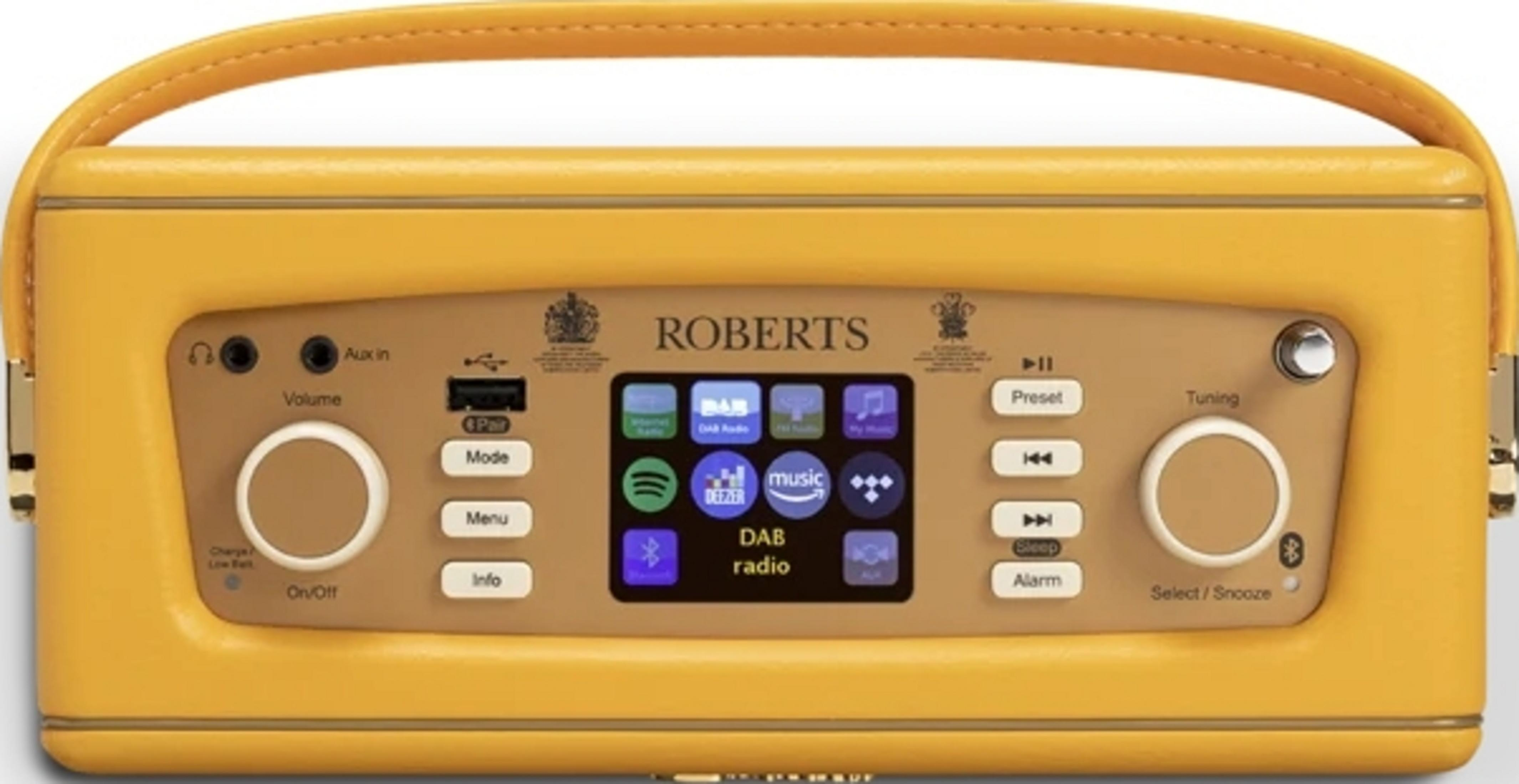 Gelbes Radio mit Bildschirm, Knöpfen und Griff. Zeigt Musik-Apps an.