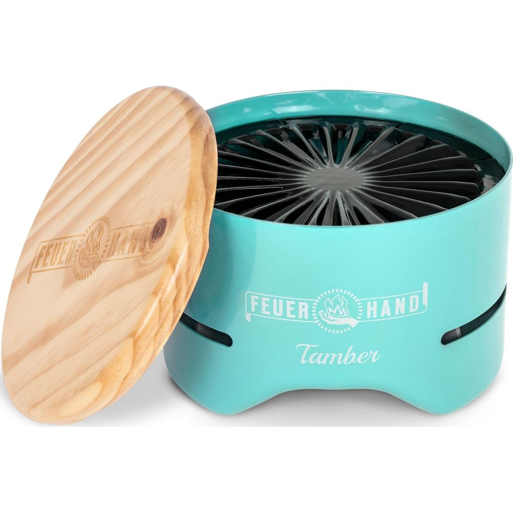Un ventilatore turchese con coperchio in legno. C'è scritto 'FEUER HAND'.
