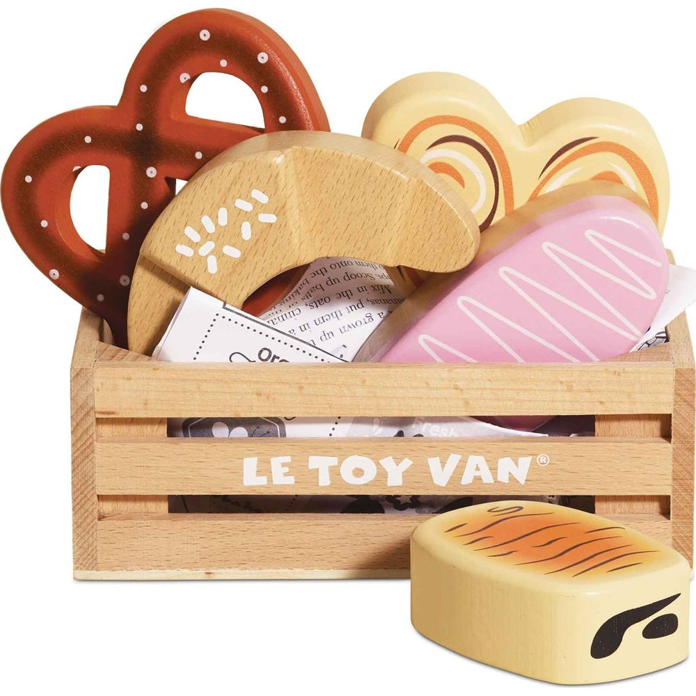 Holzkiste mit Spielzeuggebäck: Brezel, Croissant, Donut, Brot