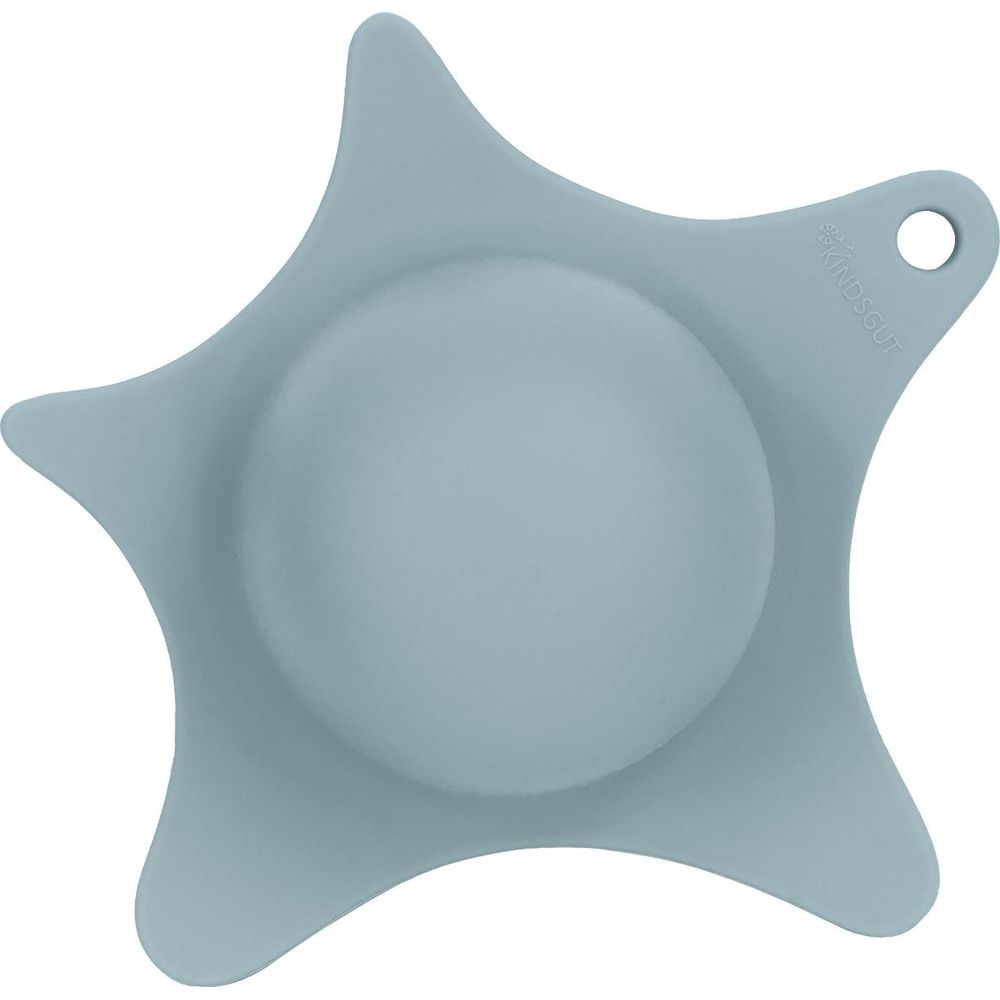 Una ventosa blu chiaro a forma di stella con una rientranza rotonda al centro.