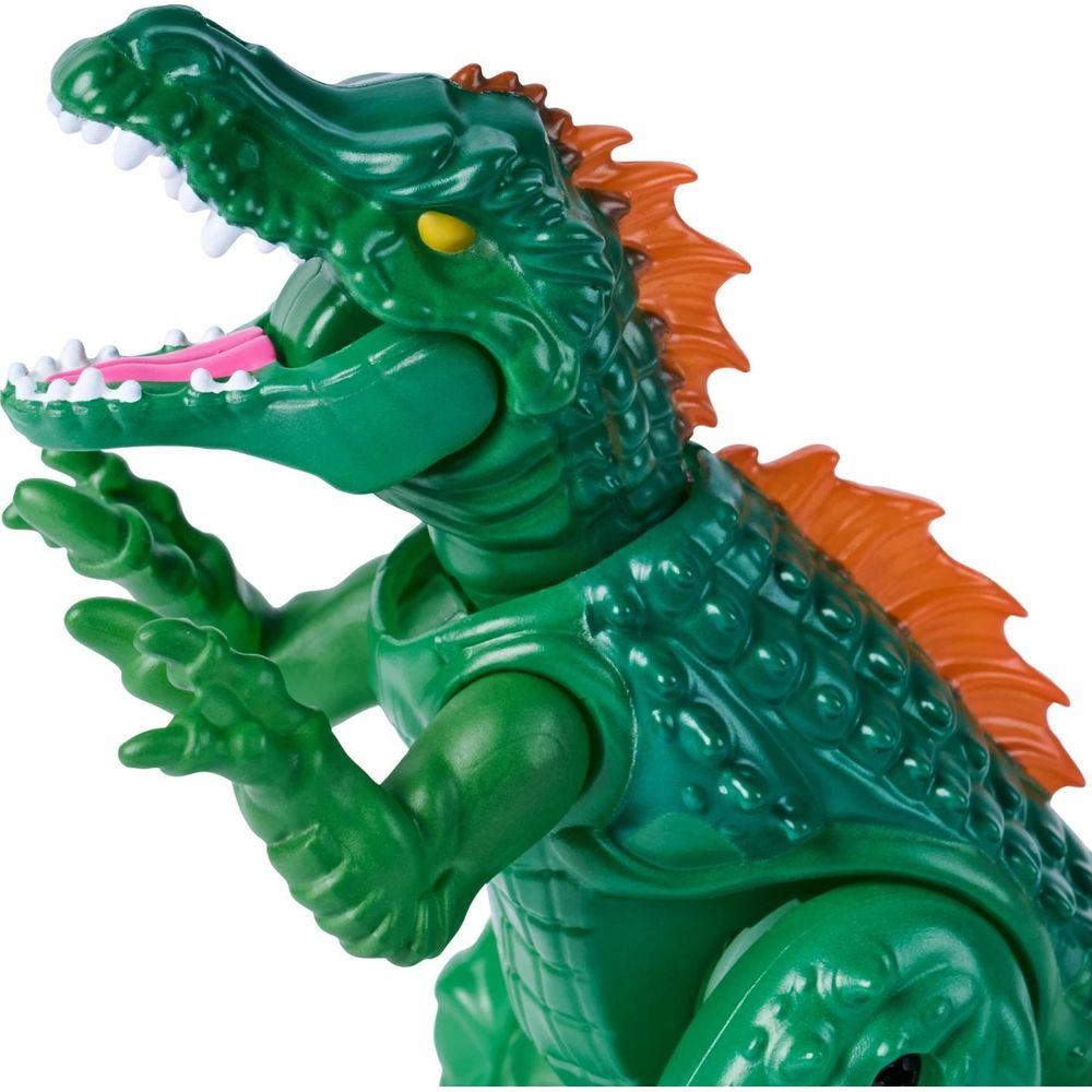 Figura de cocodrilo verde con boca abierta, cresta naranja y ojos amarillos.
