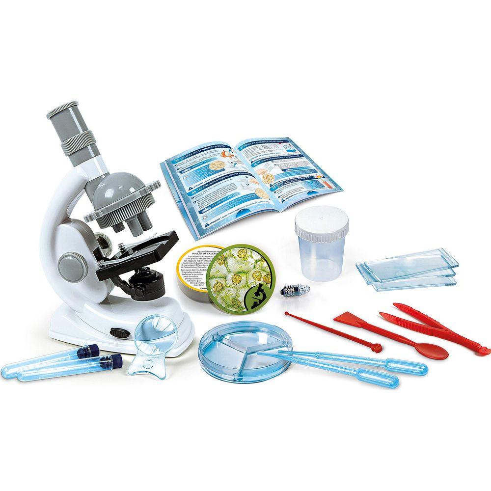 Un set di microscopio con vari strumenti, provette e istruzioni.