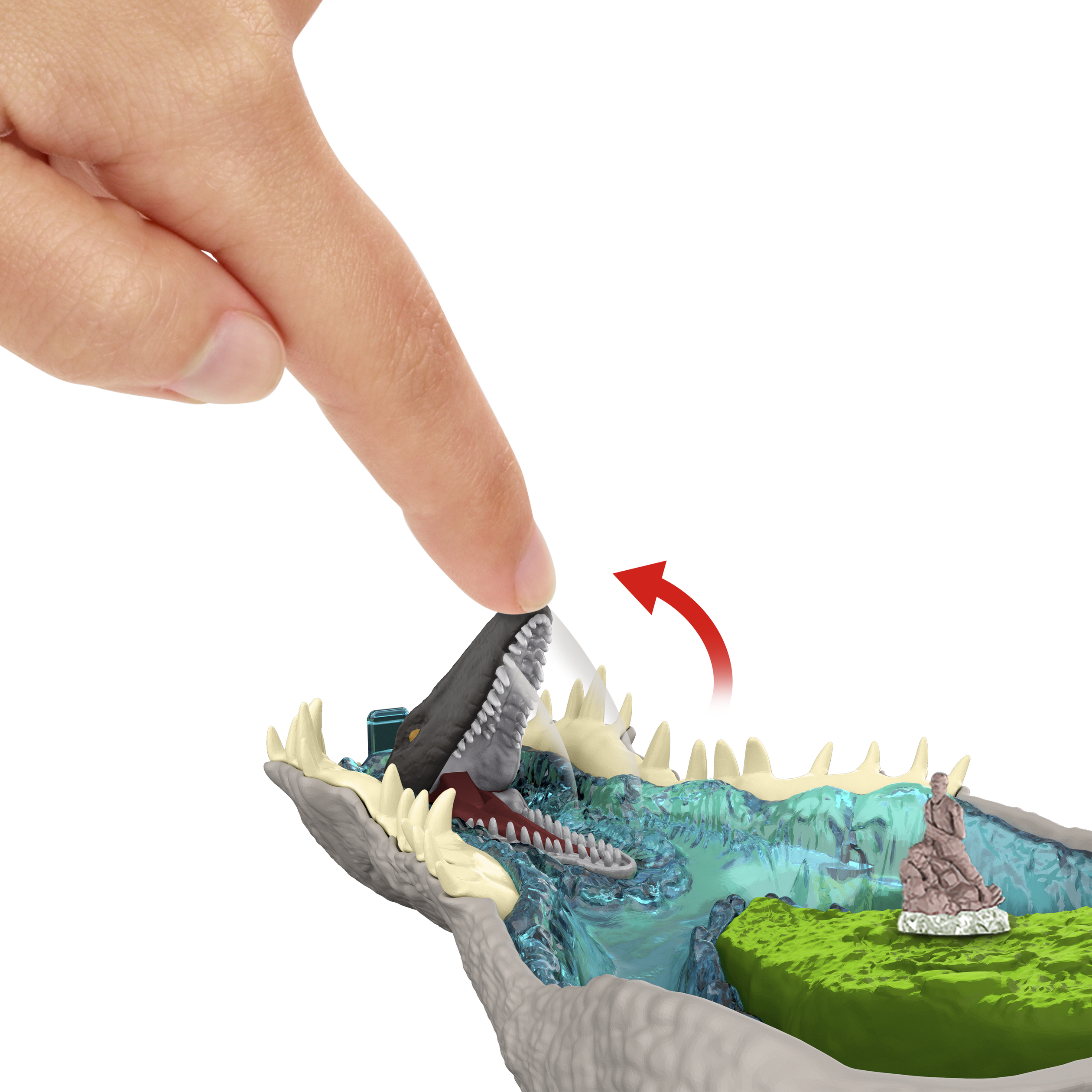 Un dedo presiona la boca de un dinosaurio de juguete con dientes afilados.