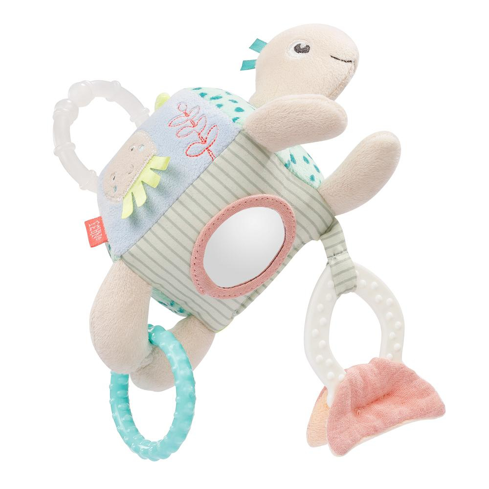 Un giocattolo a forma di tartaruga di peluche con varie texture e uno specchio.