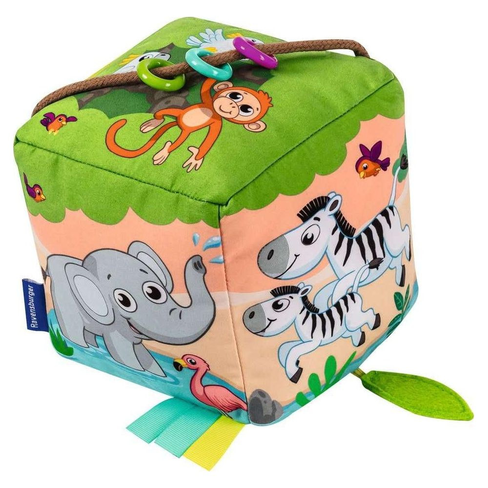 Ein Stoffwürfel mit Dschungeltieren wie Elefant, Zebras, Affe und Flamingo.