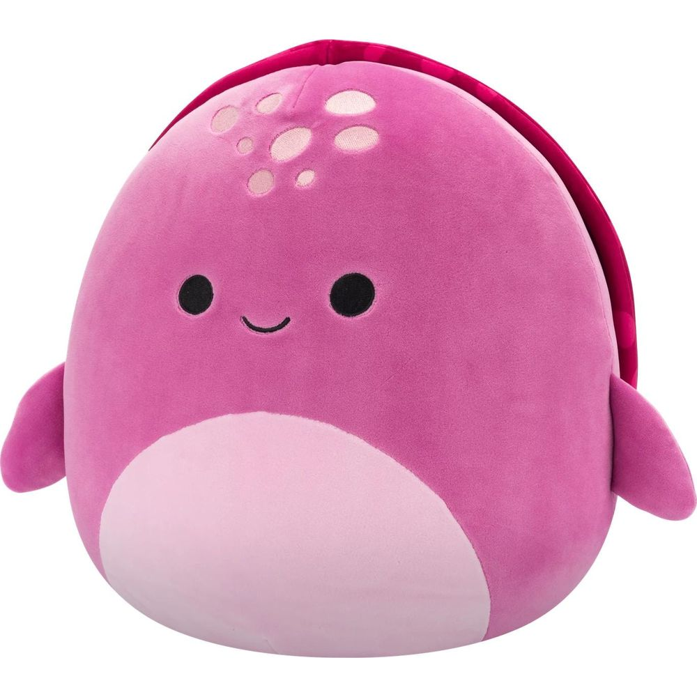Une baleine en peluche rose avec un ventre plus clair et une carapace rouge.