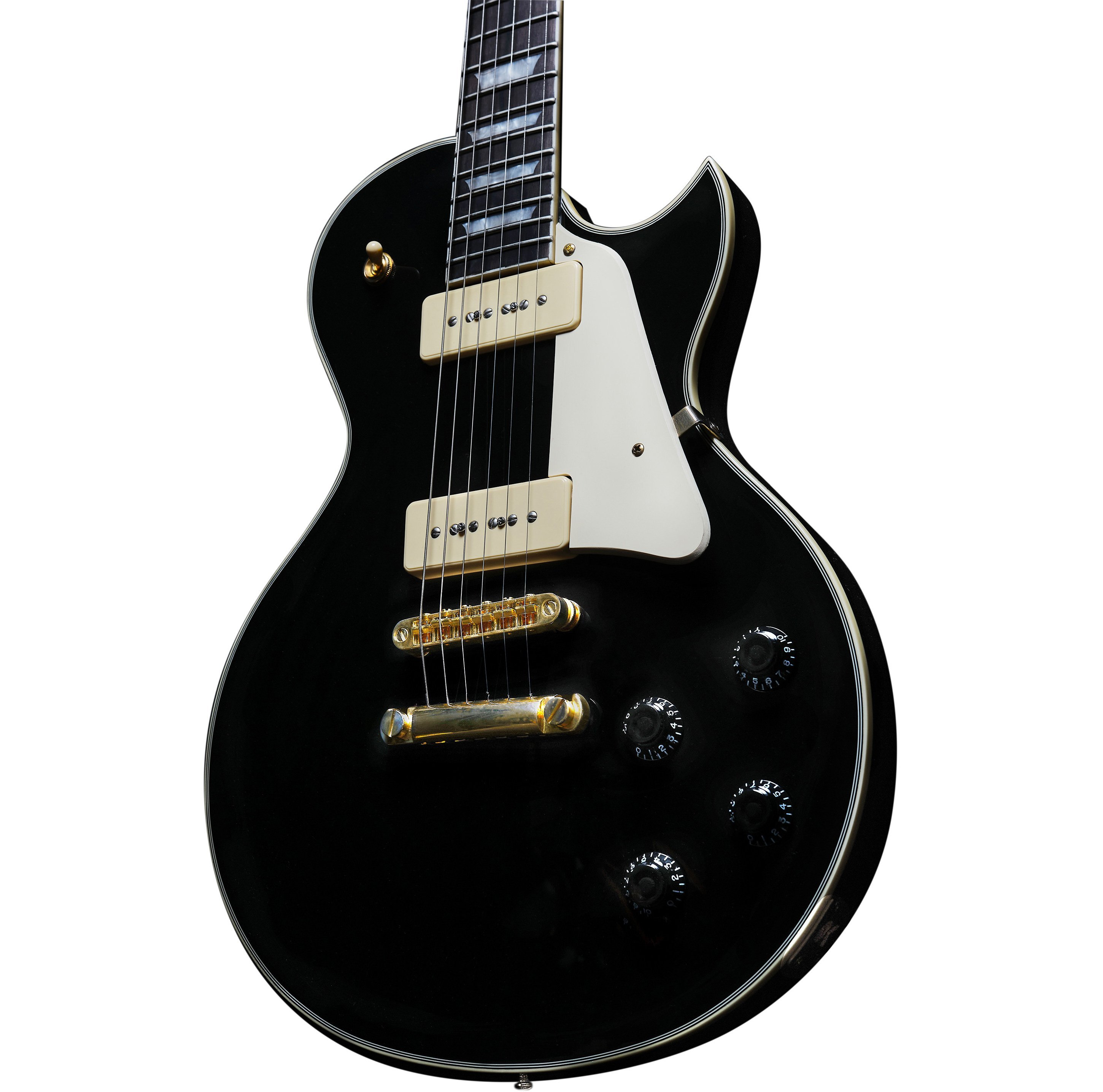 Altın donanımlı, krem renkli manyetikli siyah elektro gitar, yakından.