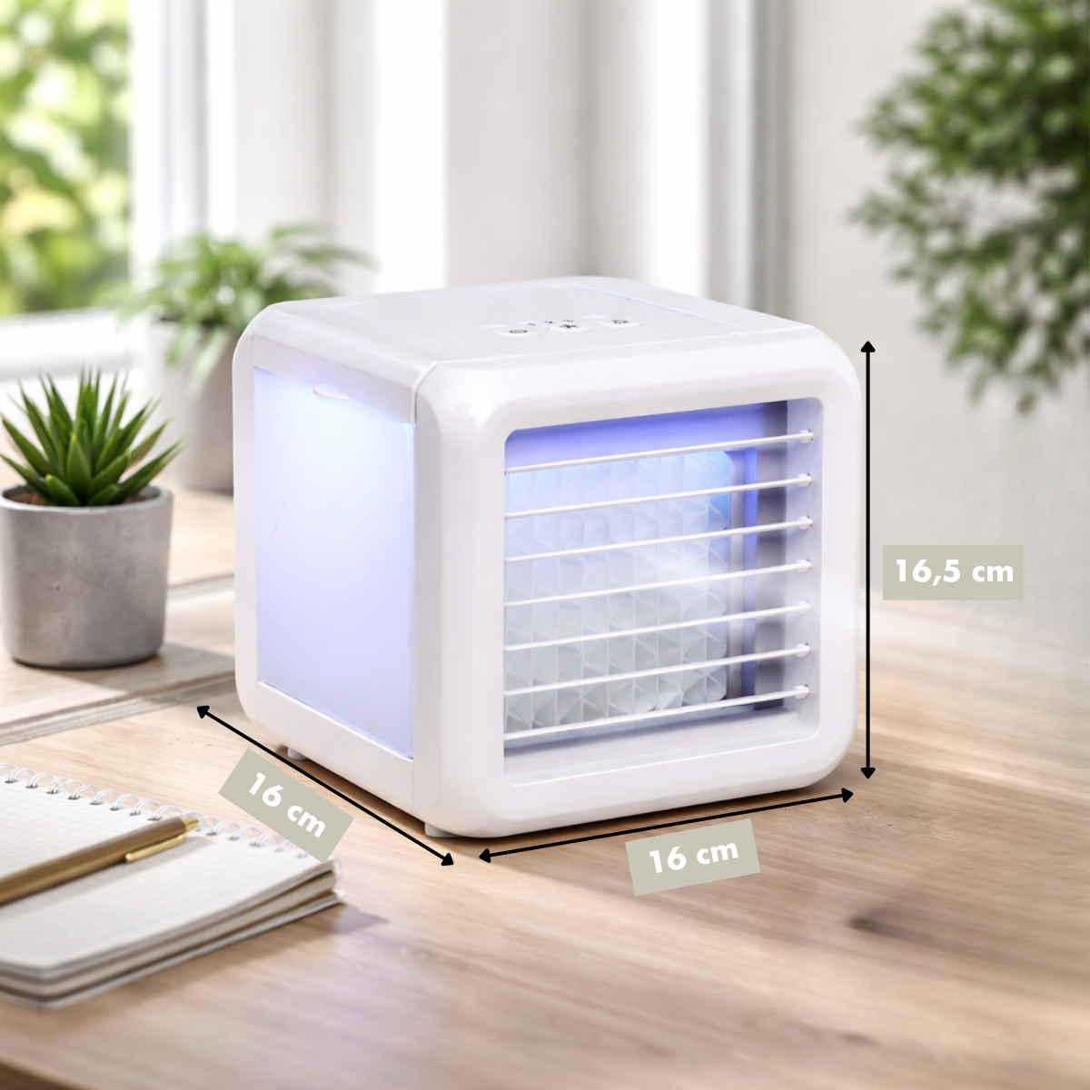 A small white air cooler with blue lighting sits on a wooden table.