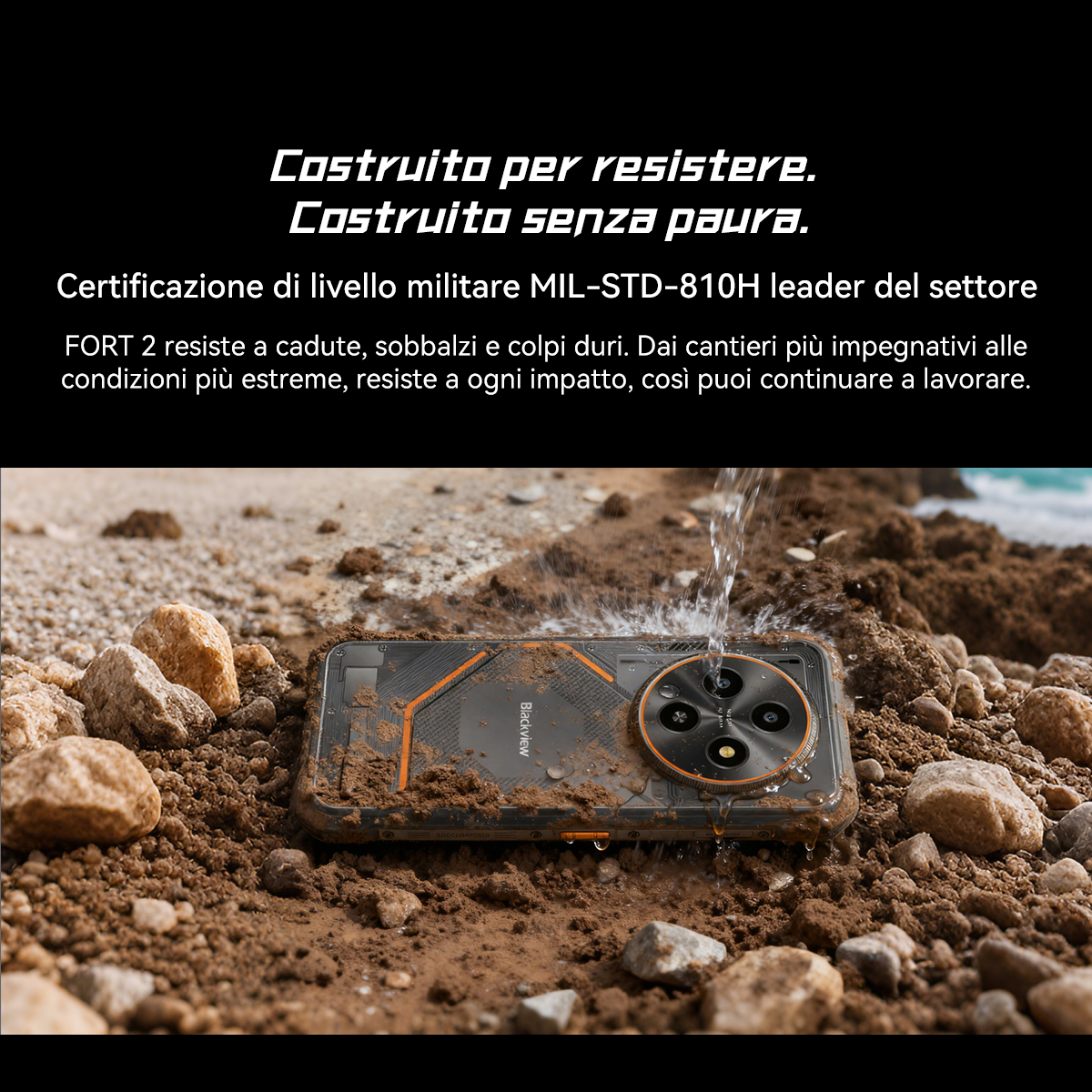 Wytrzymały smartfon leży w ziemi, obryzguje go woda. Posiada certyfikat MIL-STD-810H.