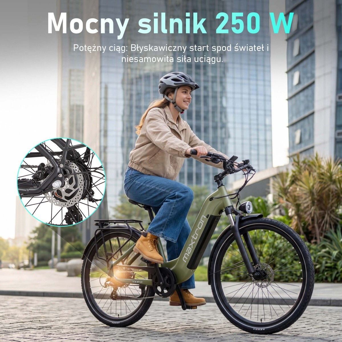 Kobieta jedzie zielonym rowerem elektrycznym w mieście, skupiając się na silniku.