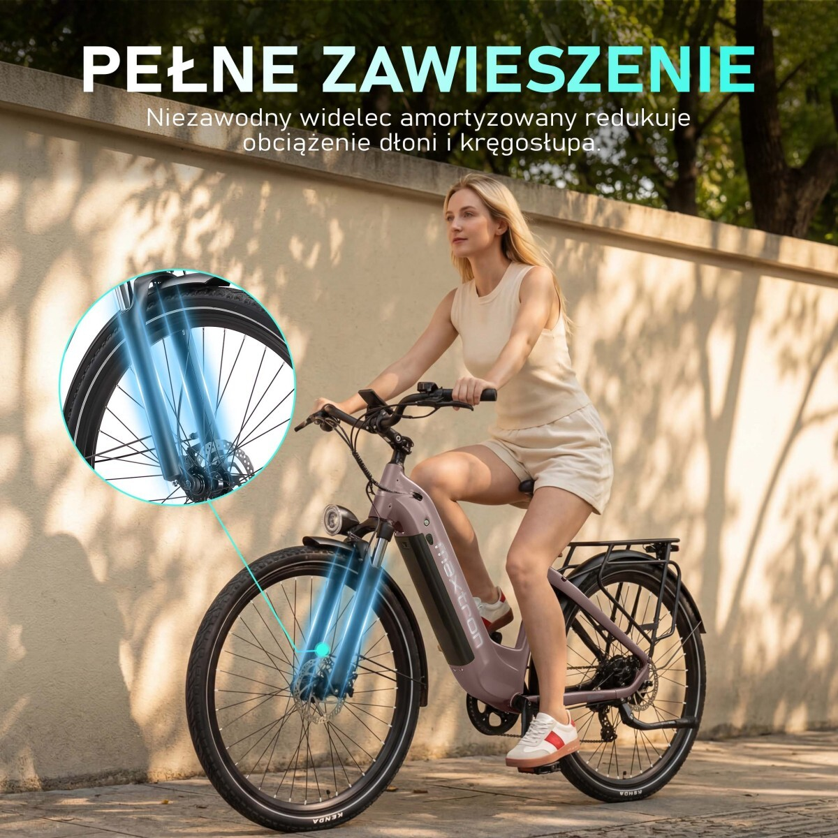 Kobieta jedzie na różowym rowerze elektrycznym z amortyzacją przednią. Zbliżenie widelca.