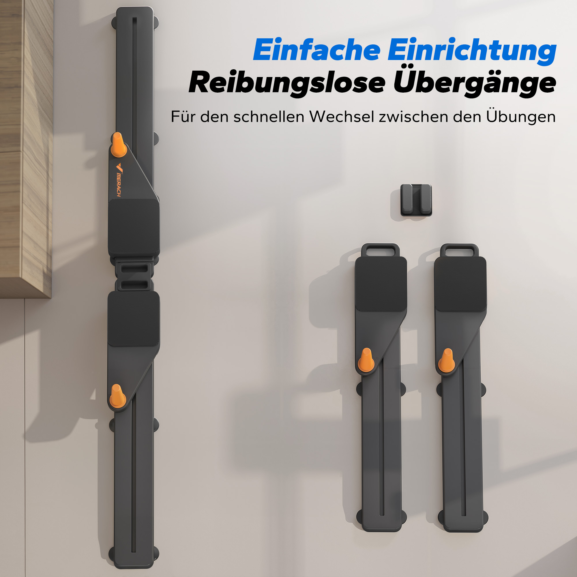 Graue Fitnessgeräte mit orangen Akzenten an einer Wand.