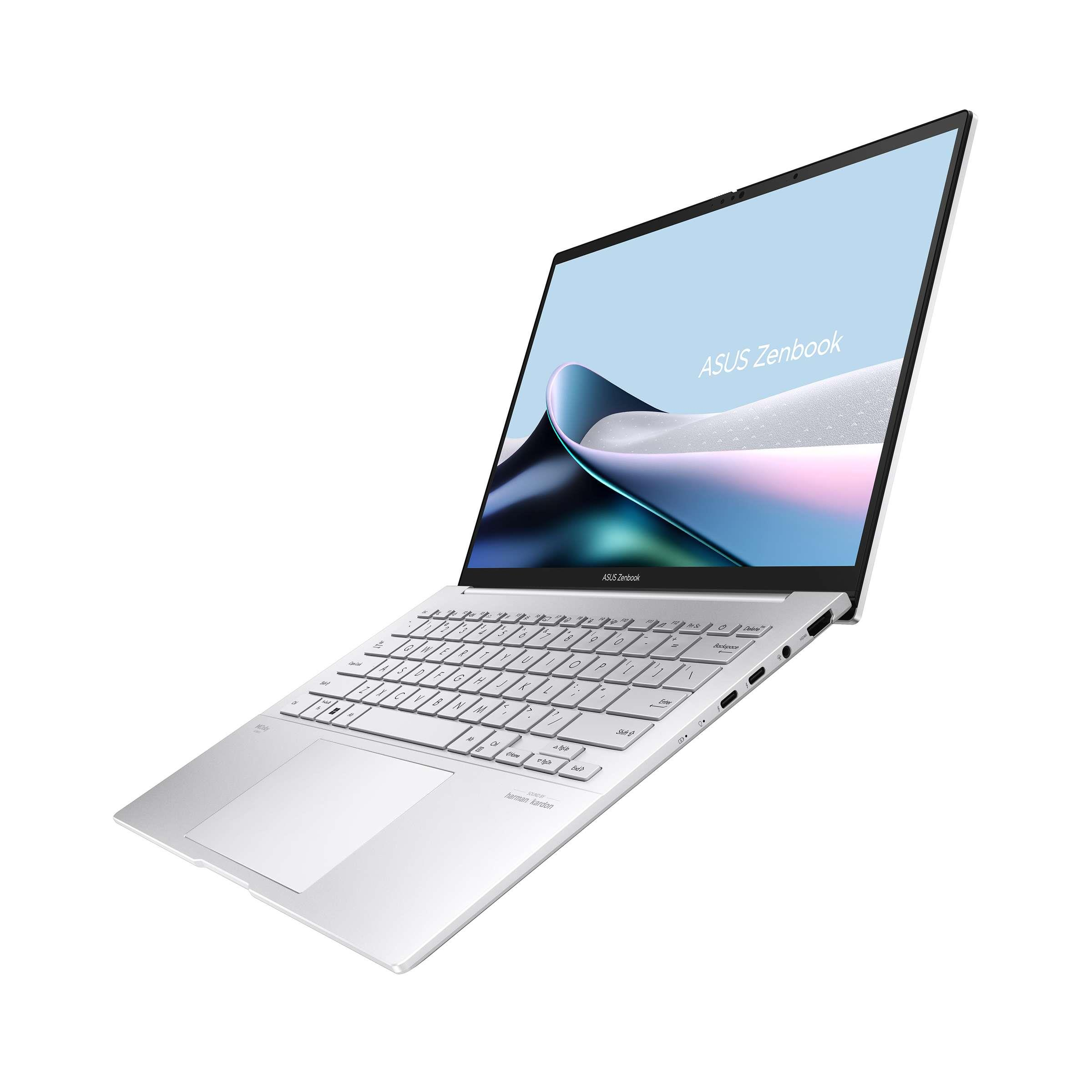 Arkadan aydınlatmalı klavyeli ve dokunmatik yüzeyli gümüş Asus Zenbook laptop.