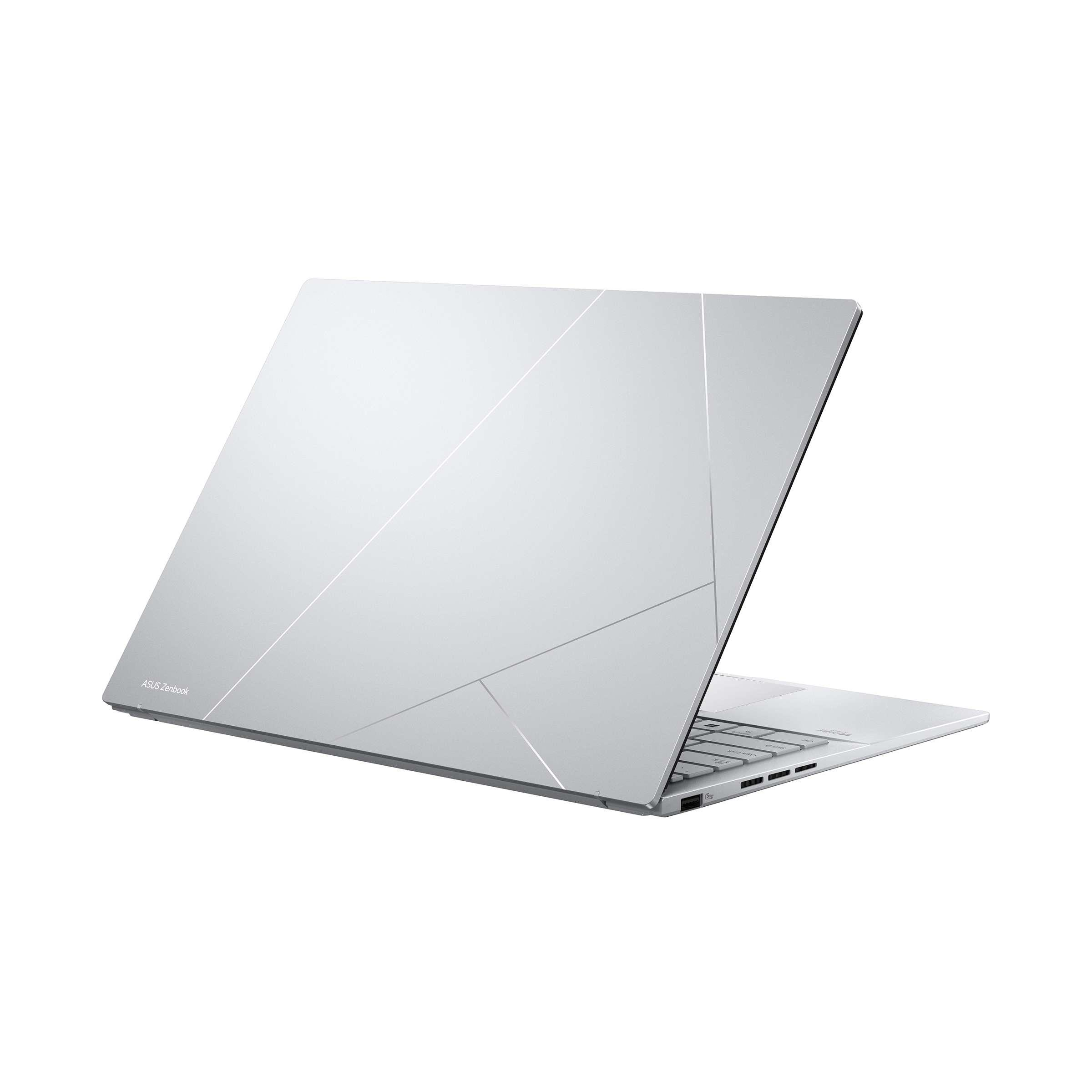 Kapaktaki asimetrik çizgili ve "ASUS Zenbook" logolu gümüş rengi dizüstü bilgisayar.