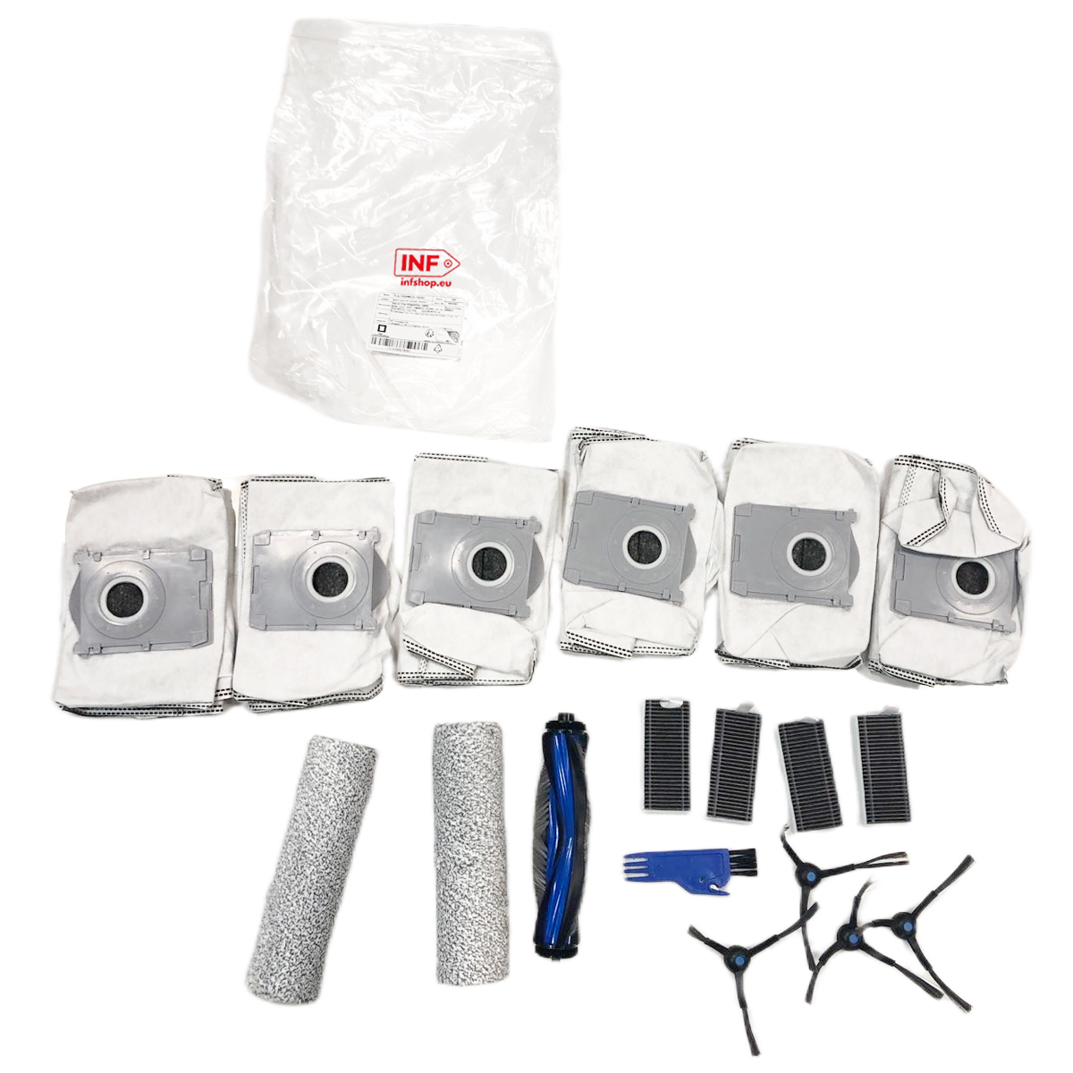 Sacs d'aspirateur, rouleaux, brosses et filtres sur fond blanc.