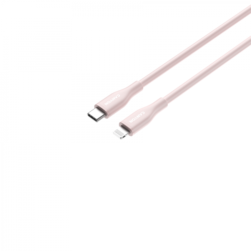 Jasnoróżowy kabel ładujący z portami USB-C i Lightning leży po przekątnej.