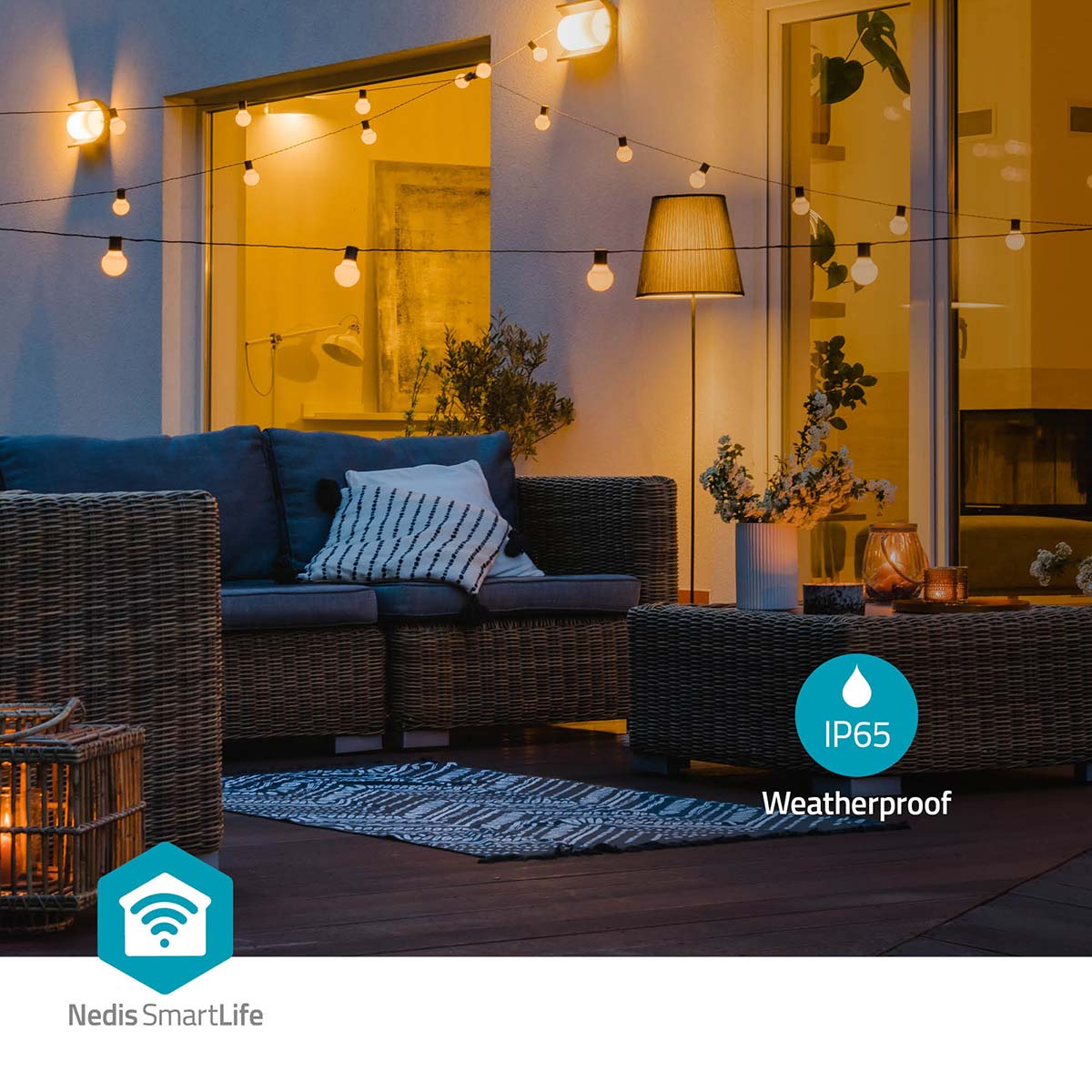 An illuminated patio with furniture and string lights at night.