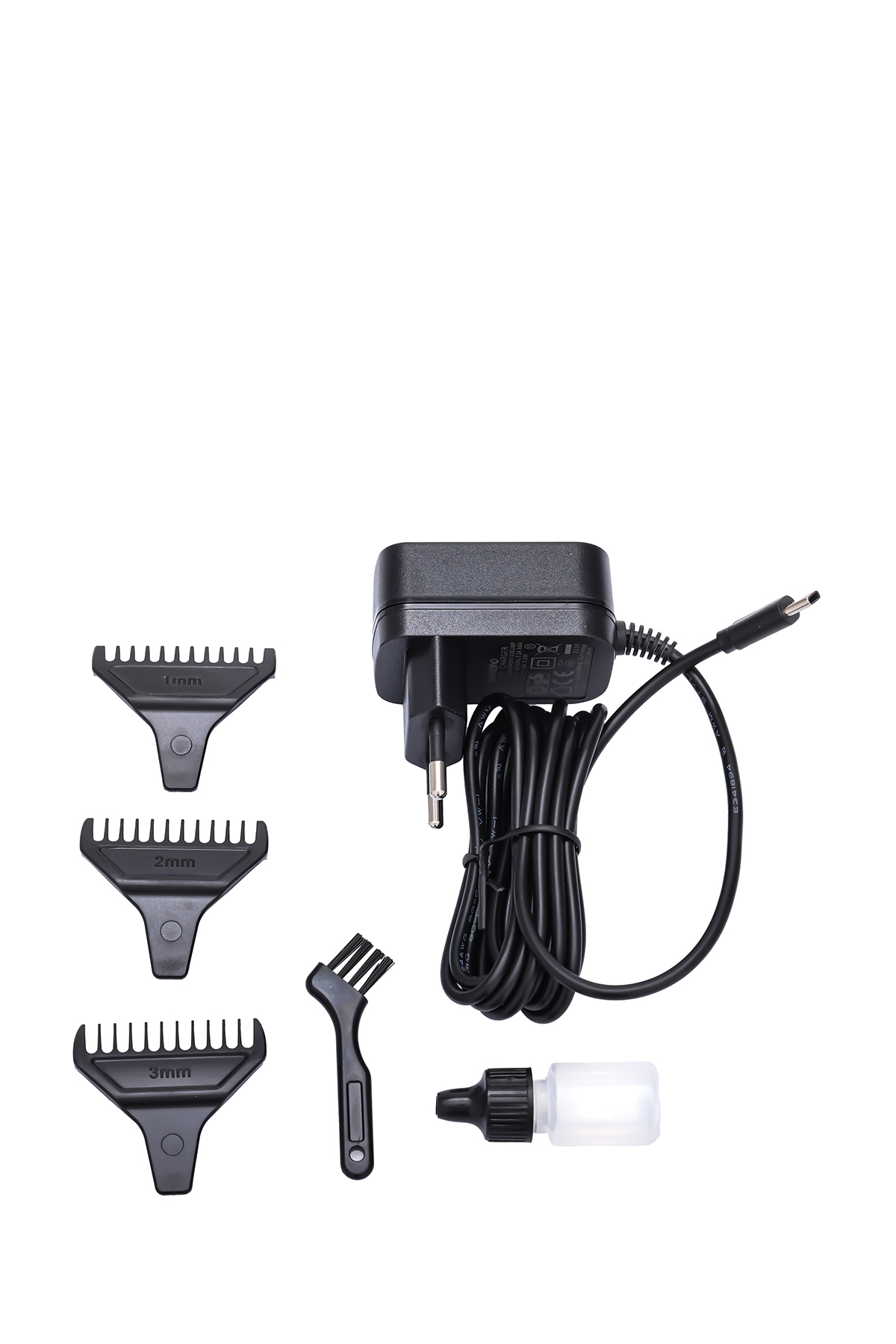 Güç adaptörü, üç kılavuz tarak (1, 2, 3 mm), fırça ve yağ şişesi.