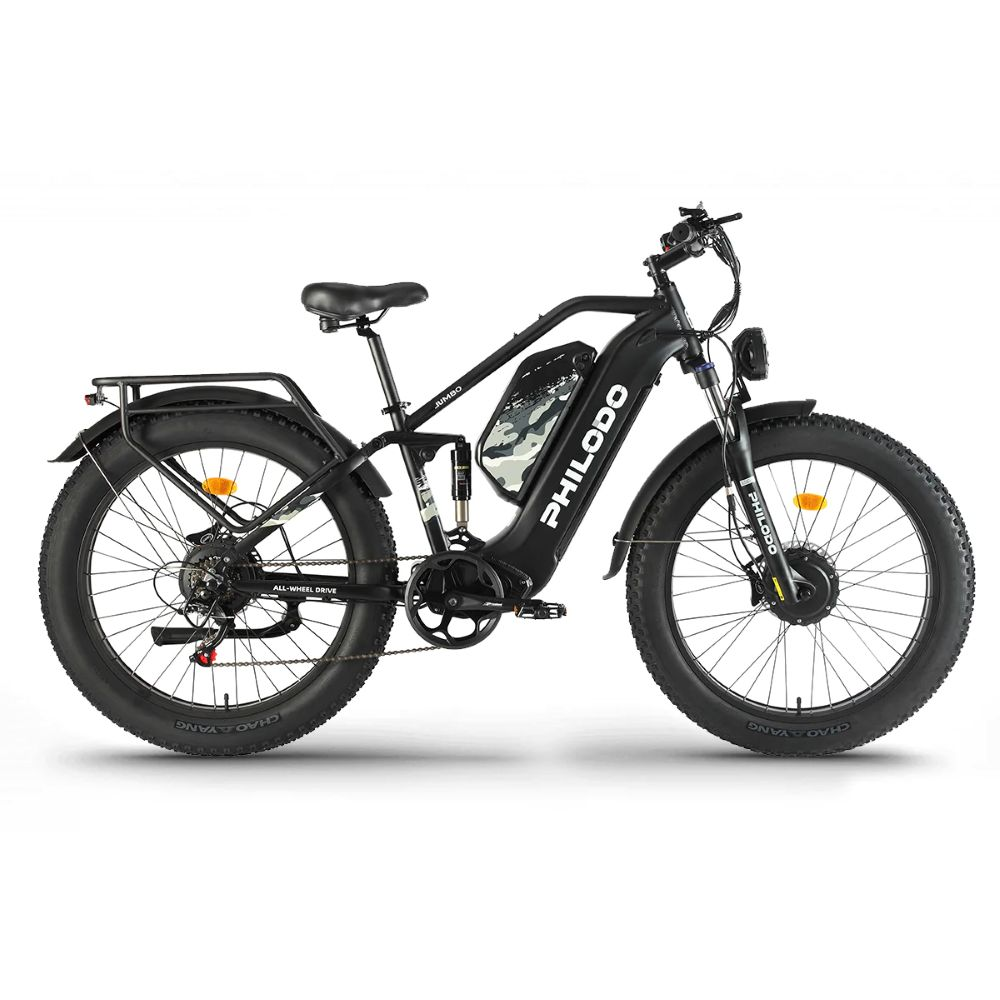 Bicicleta eléctrica negra de llantas anchas con suspensión y portaequipajes.