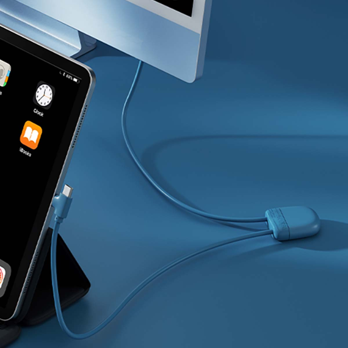 Un tablet e un monitor sono collegati da un cavo blu.
